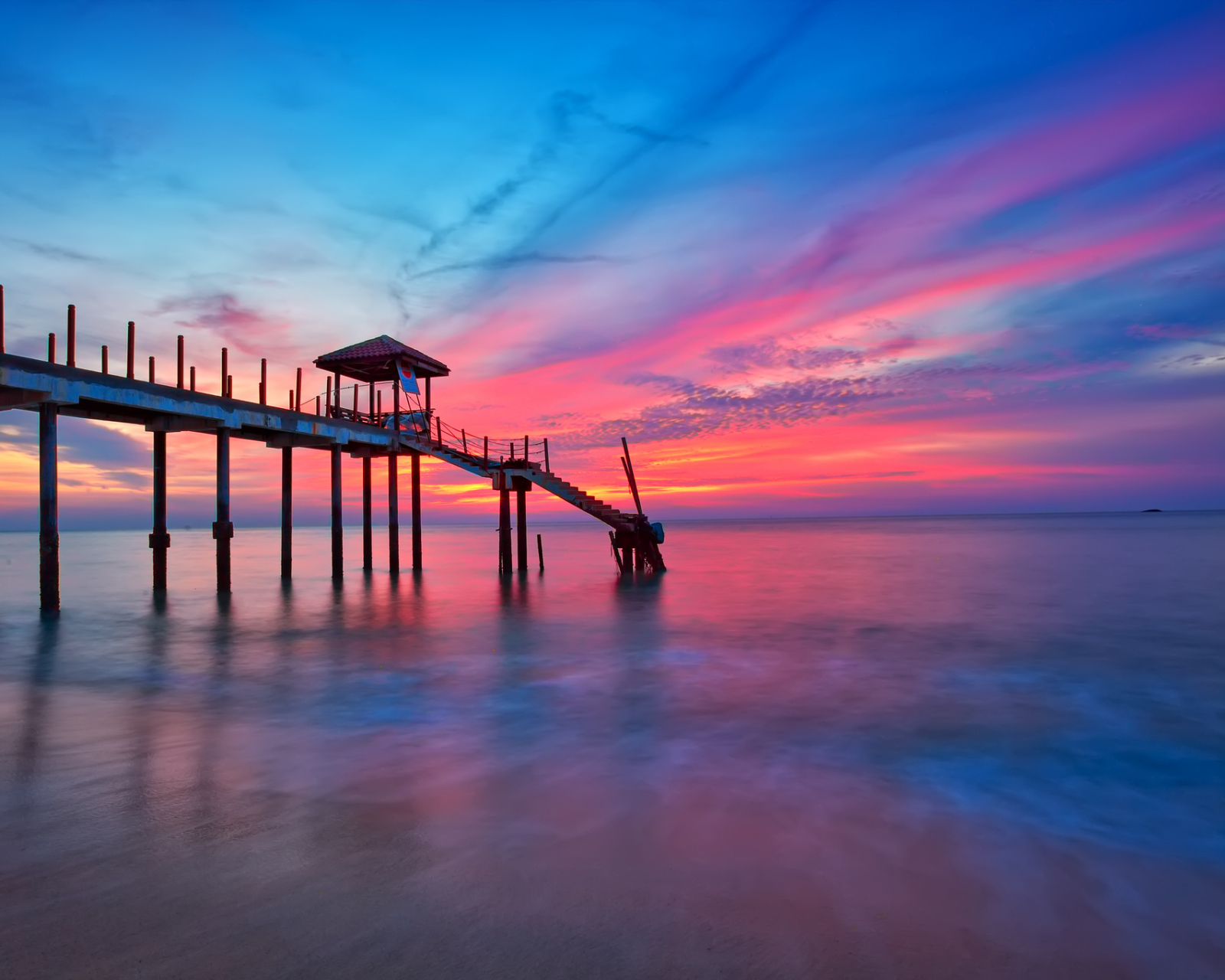 Download mobile wallpaper Sunset, Sky, Pink, Pier, Ocean, Purple, Man Made for free.
