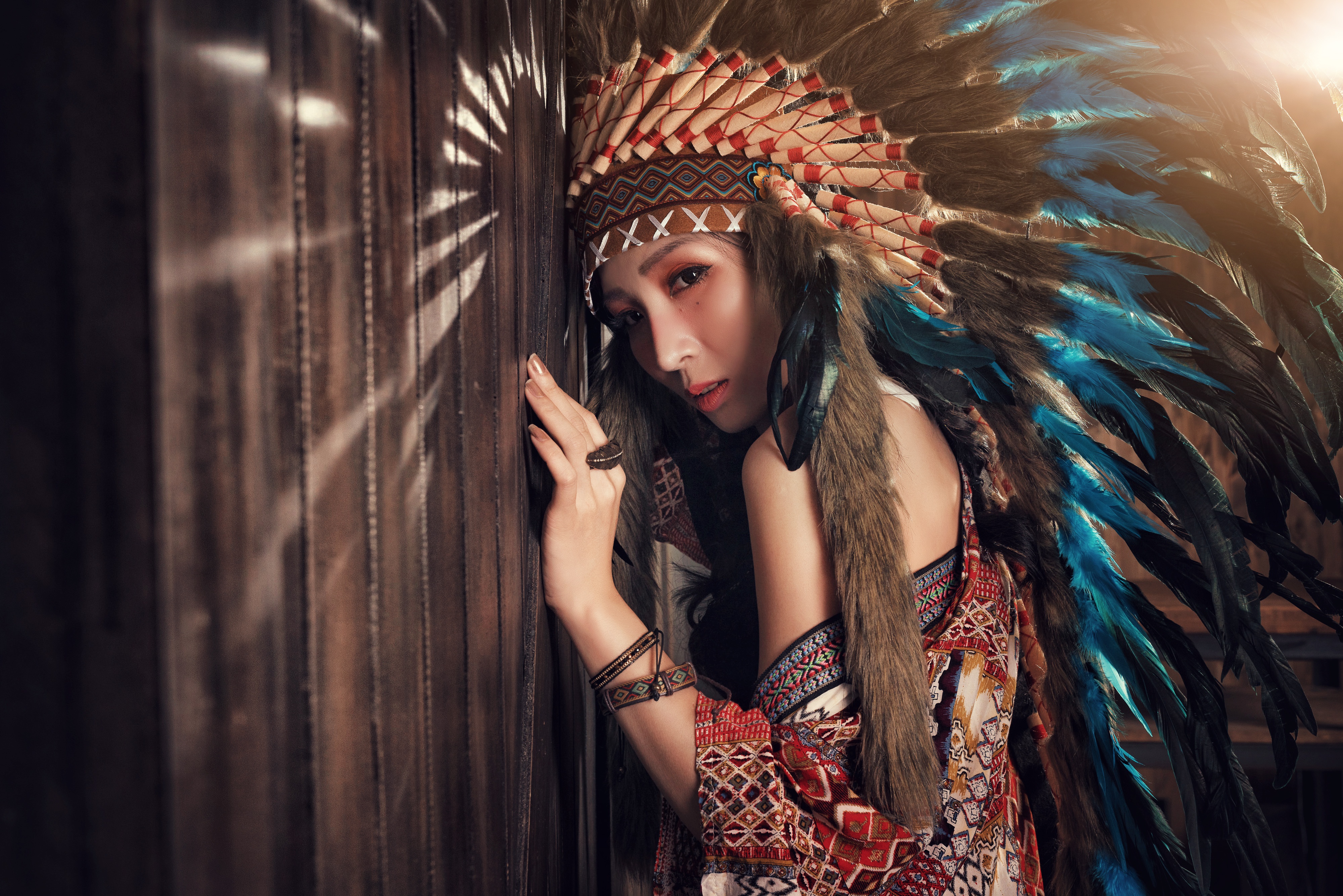 Download mobile wallpaper Feather, Model, Women, Headdress, Asian, Brown Eyes, Native American for free.