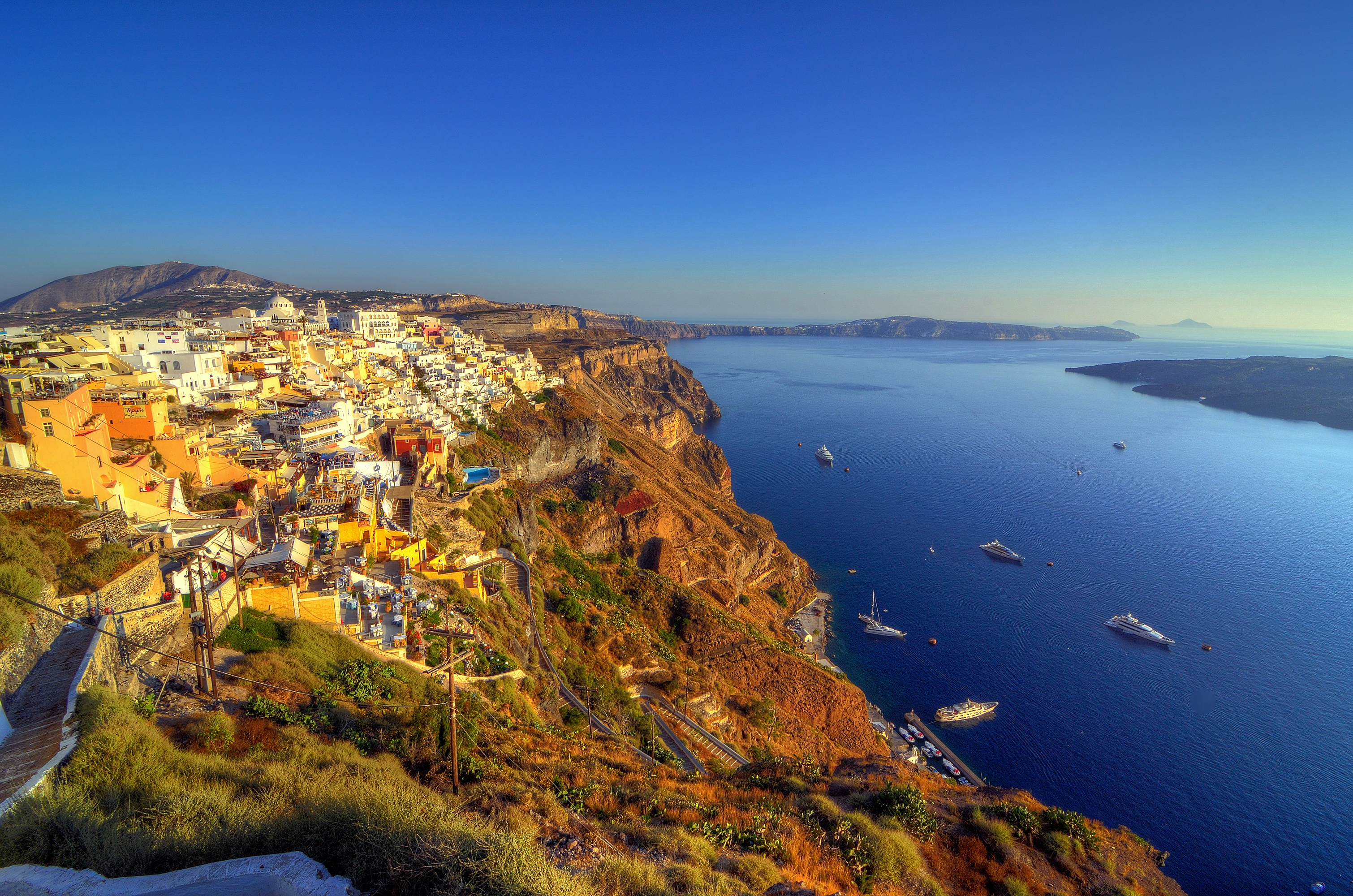 Download mobile wallpaper Sea, Horizon, Coast, Boat, Panorama, Greece, Santorini, Man Made, Towns for free.