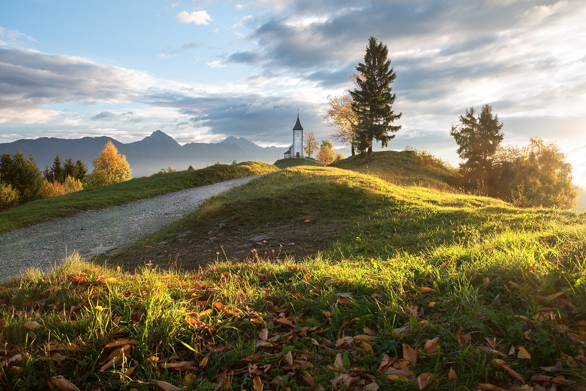 Download mobile wallpaper Road, Fall, Hill, Church, Slovenia, Churches, Religious for free.