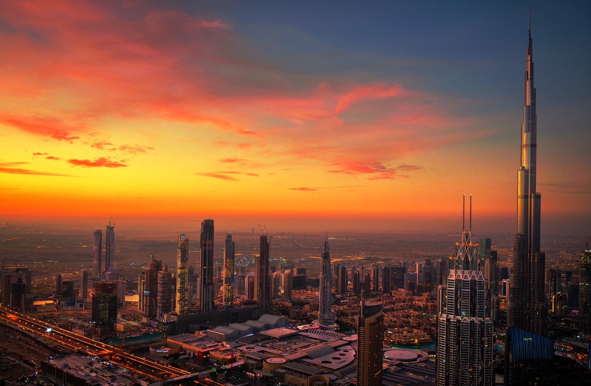 Baixar papel de parede para celular de Cidades, Pôr Do Sol, Cidade, Arranha Céu, Dubai, Construção, Emirados Árabes Unidos, Feito Pelo Homem gratuito.