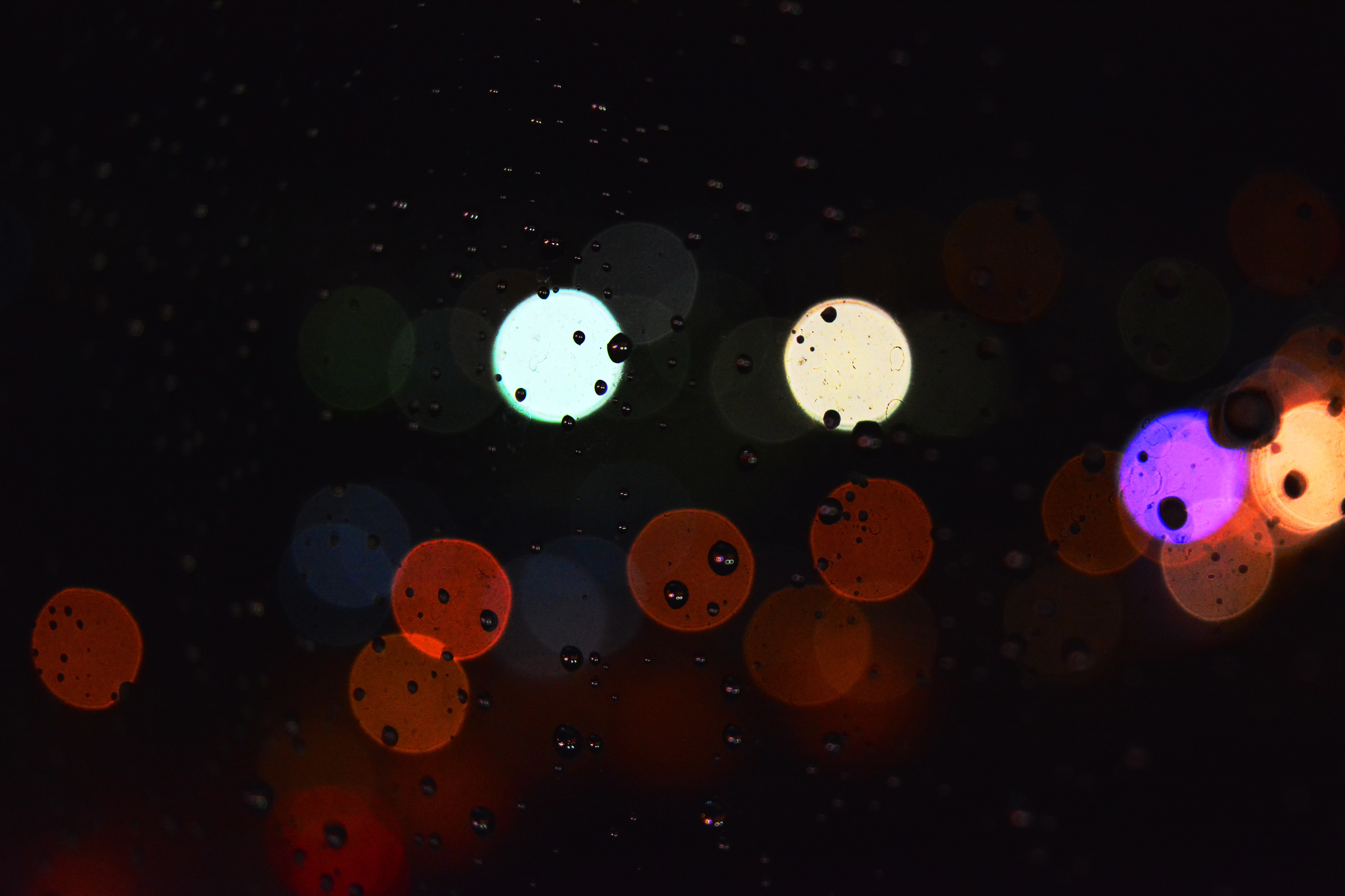 Download mobile wallpaper Glare, Surface, Circles, Drops, Abstract, Background for free.