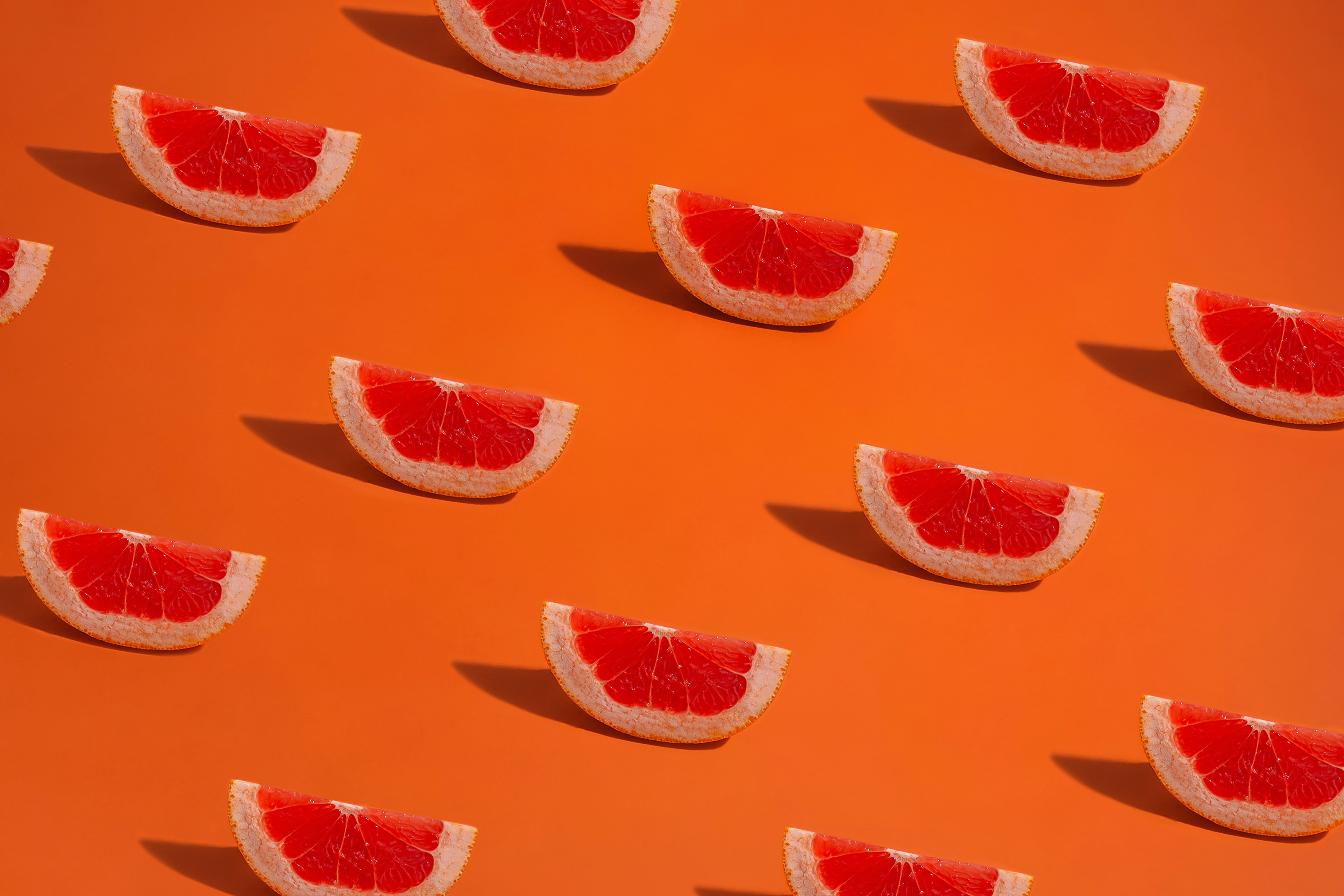 137267 завантажити шпалери грейпфрут, їжа, помаранчевий, візерунок, оранжевий, патерн, часточки, фрагменти - заставки і картинки безкоштовно