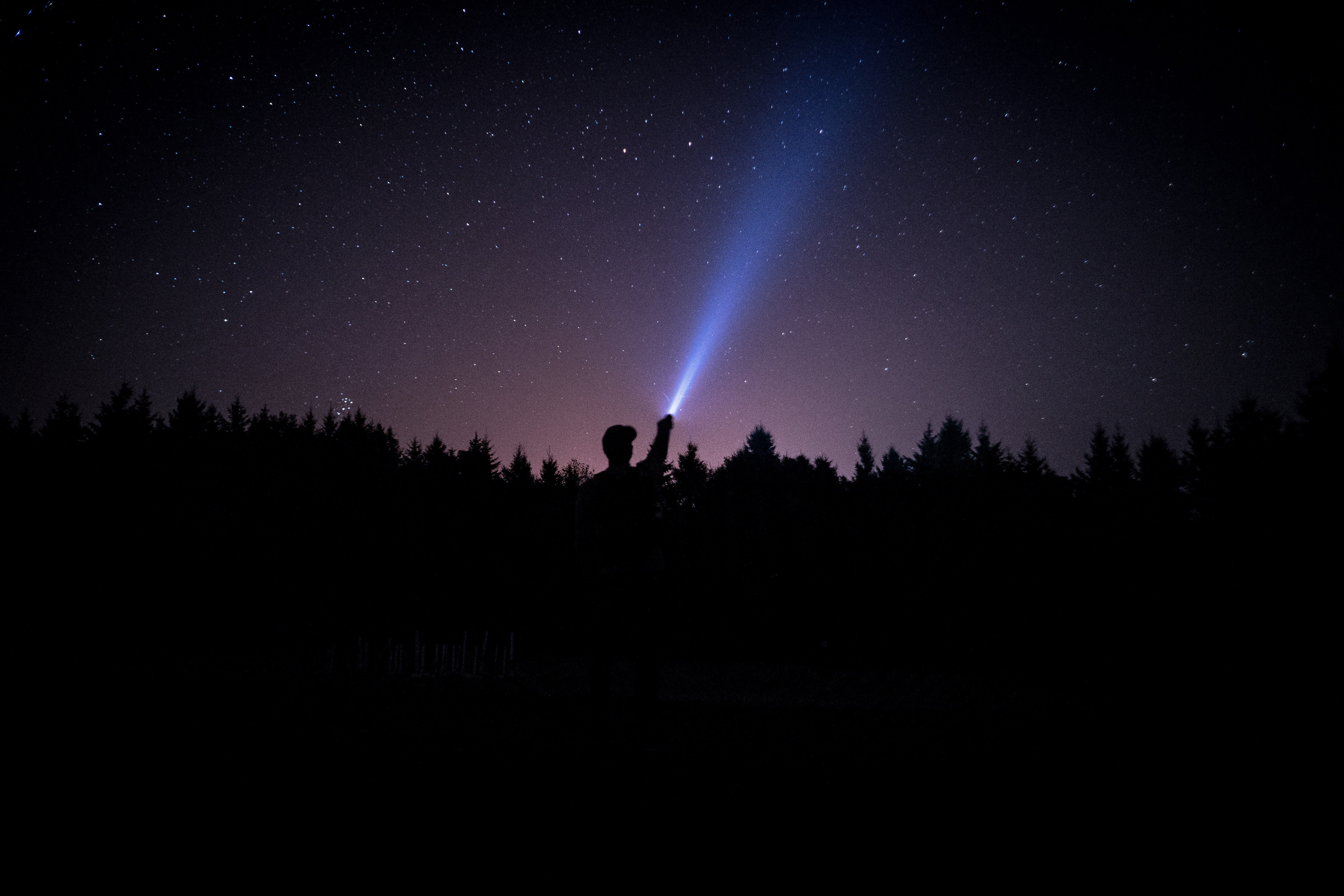 Download mobile wallpaper Person, Stars, Starry Sky, Shine, Light, Night, Human, Dark for free.