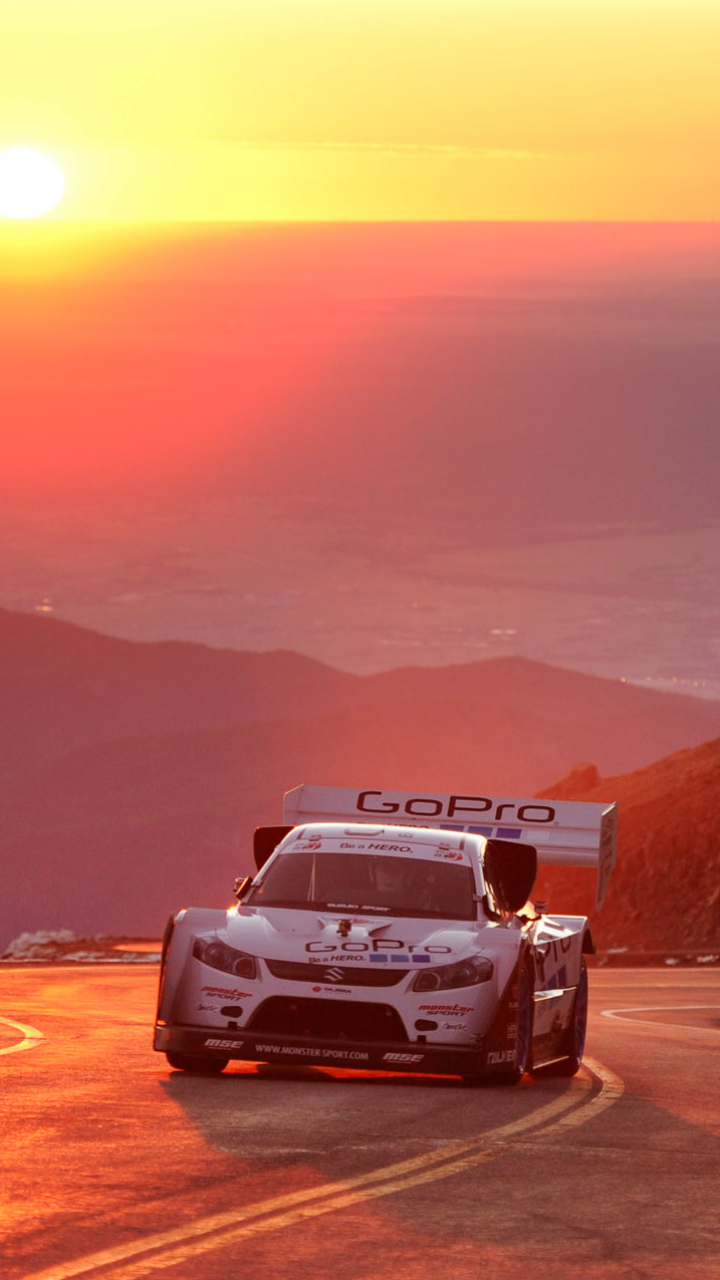 Download mobile wallpaper Sunset, Suzuki, Road, Race Car, Racing, Vehicles for free.