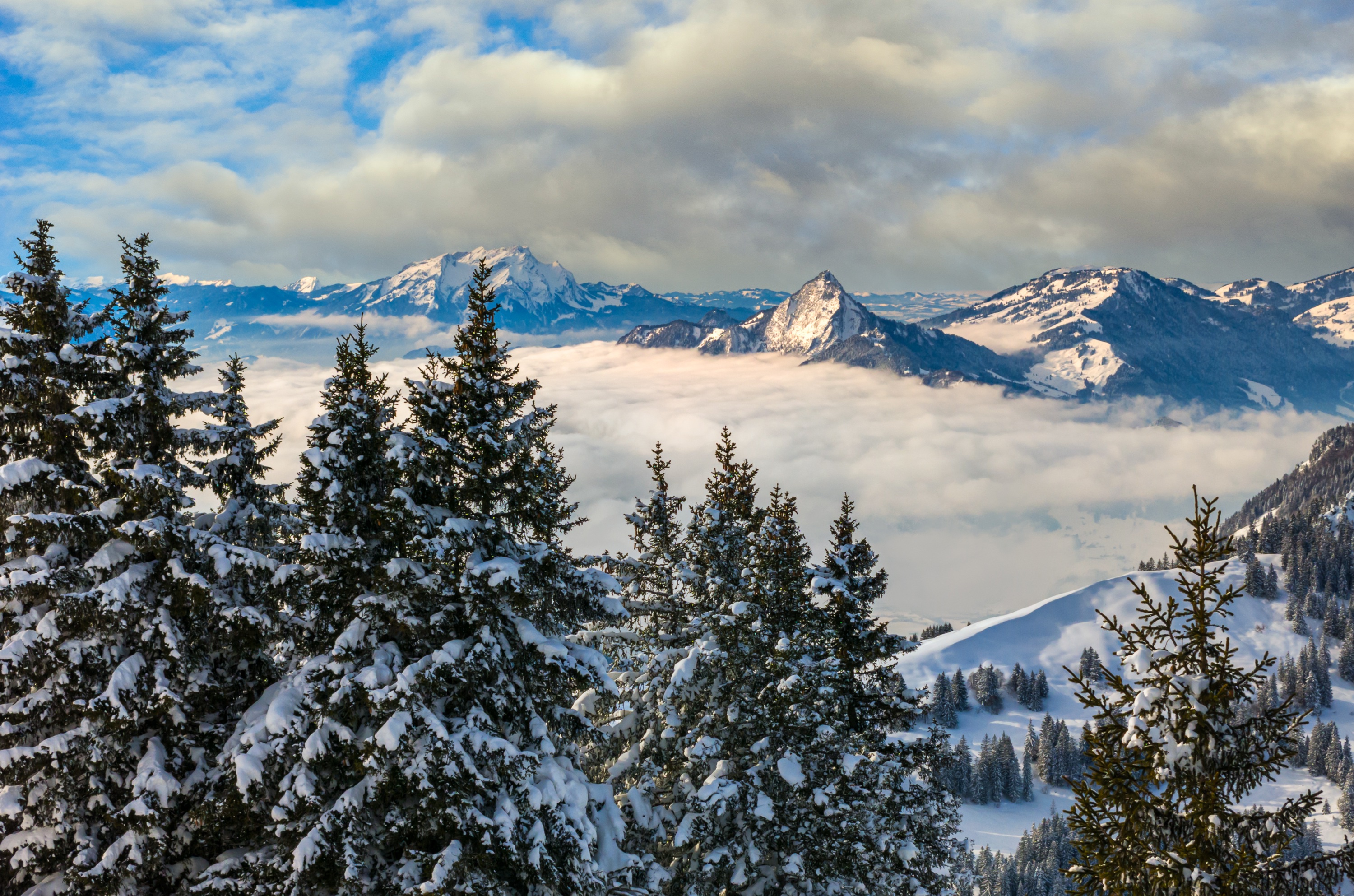 Download mobile wallpaper Landscape, Winter, Nature, Snow, Mountain, Fog, Alps, Earth, Switzerland, Cloud for free.