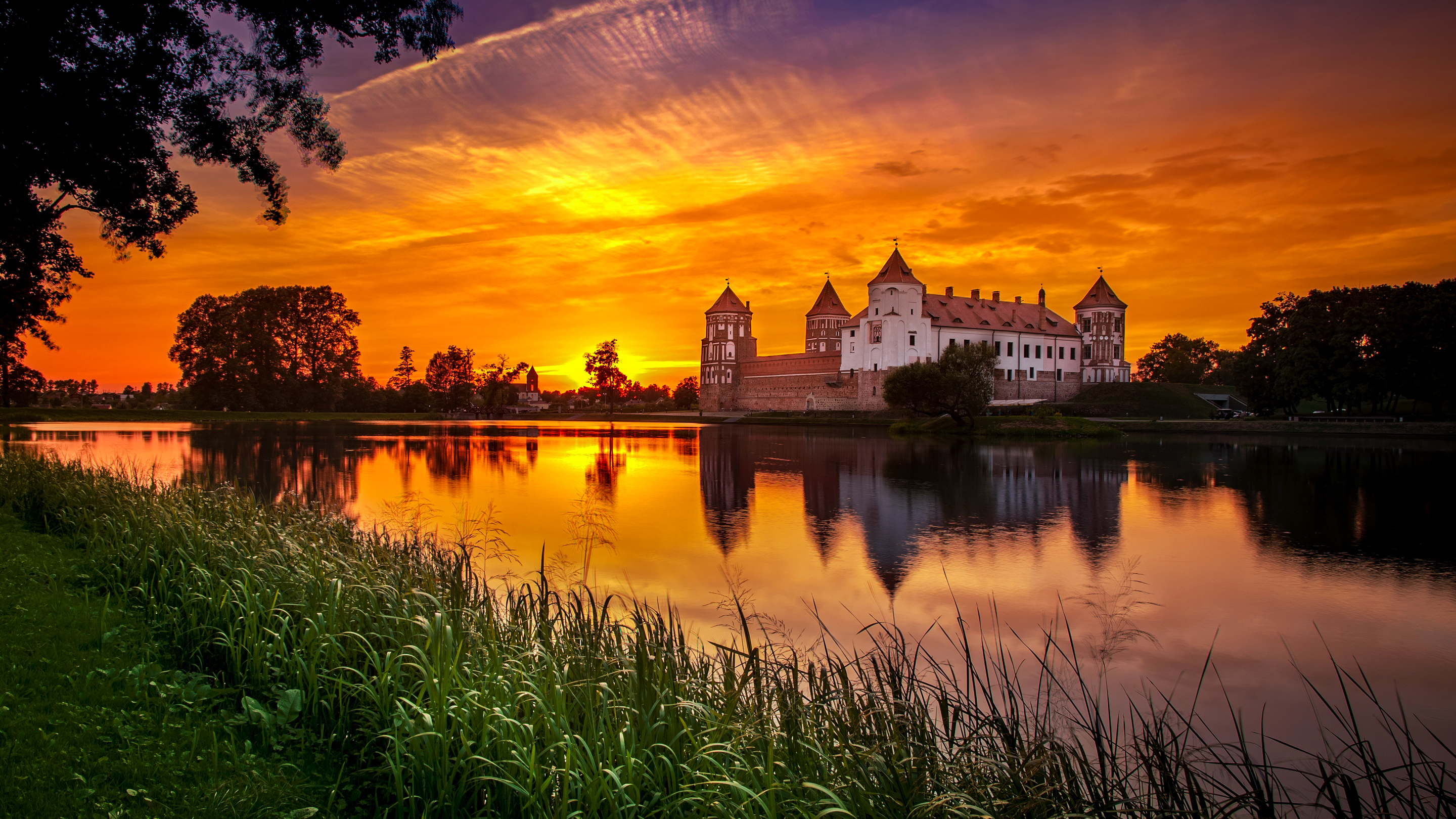 Download mobile wallpaper Sunset, Castles, Building, Lake, Reflection, Man Made, Castle for free.