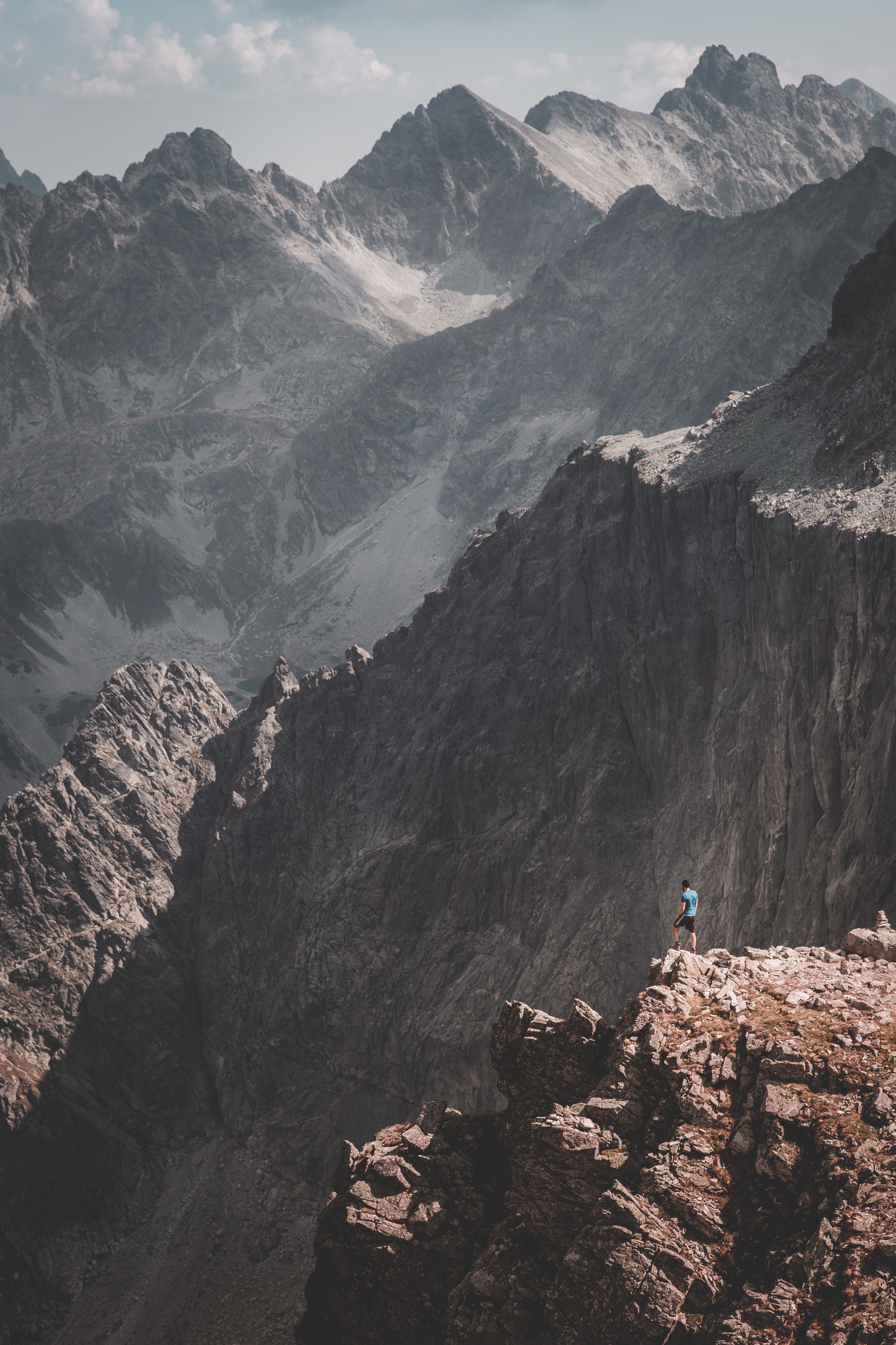 Download mobile wallpaper Loneliness, Rocks, Nature, Mountains, Person, Human for free.