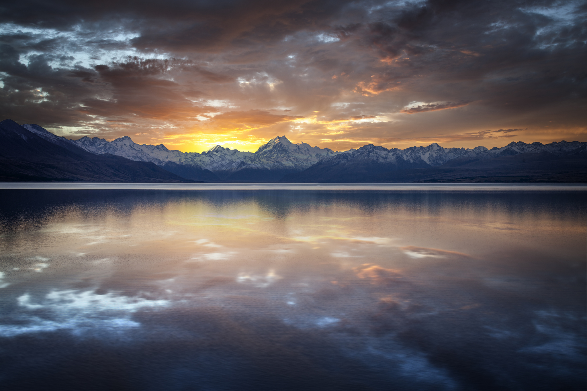 Download mobile wallpaper Sunrise, Scenic, Lakes, Water, Lake, Mountain, Earth, Reflection, Cloud, Sky, Sunset for free.