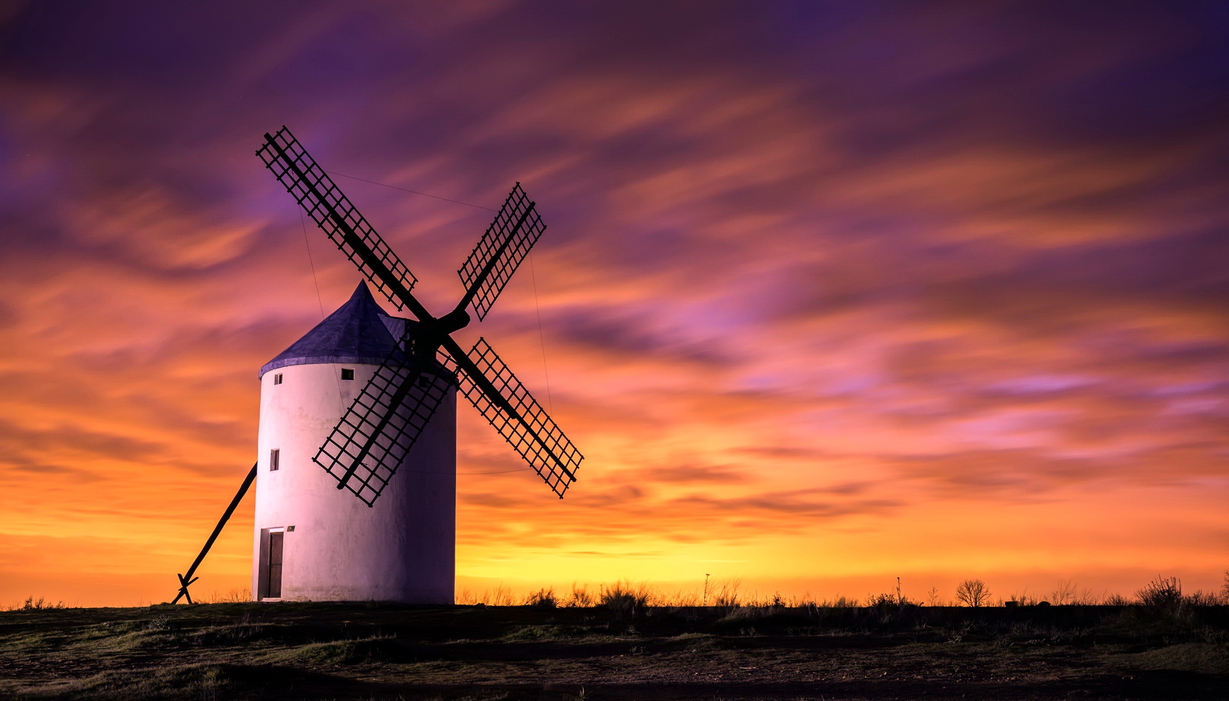 Free download wallpaper Sunset, Sky, Building, Windmill, Man Made on your PC desktop