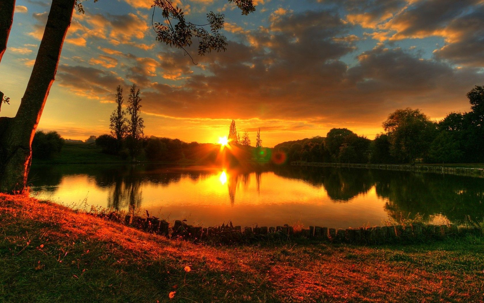 Download mobile wallpaper Evening, Nature, Lake, Glare, Sun, Sunset, Romance for free.