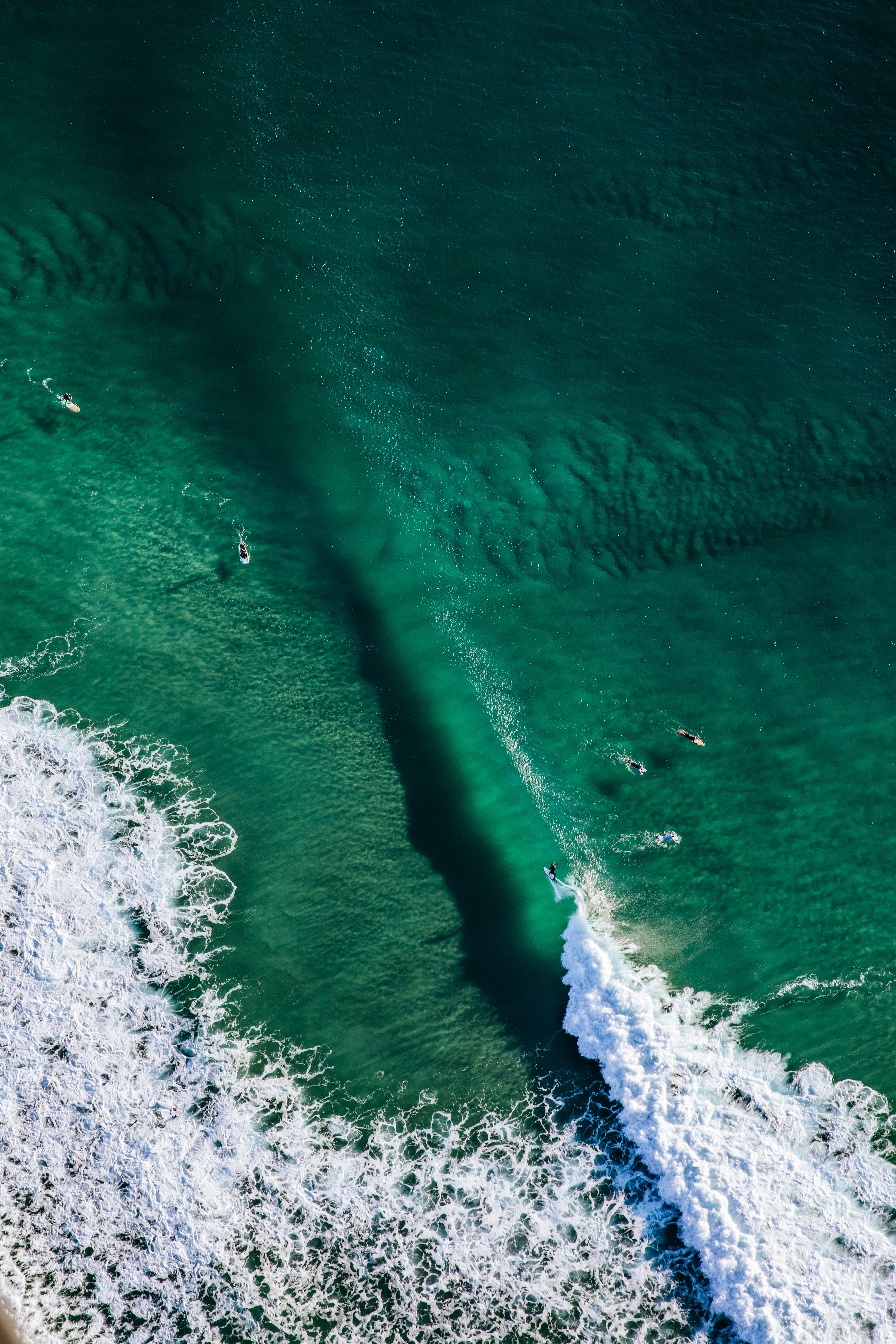 Download mobile wallpaper Surfers, View From Above, Miscellaneous, Miscellanea, Wave, Water, Ocean for free.