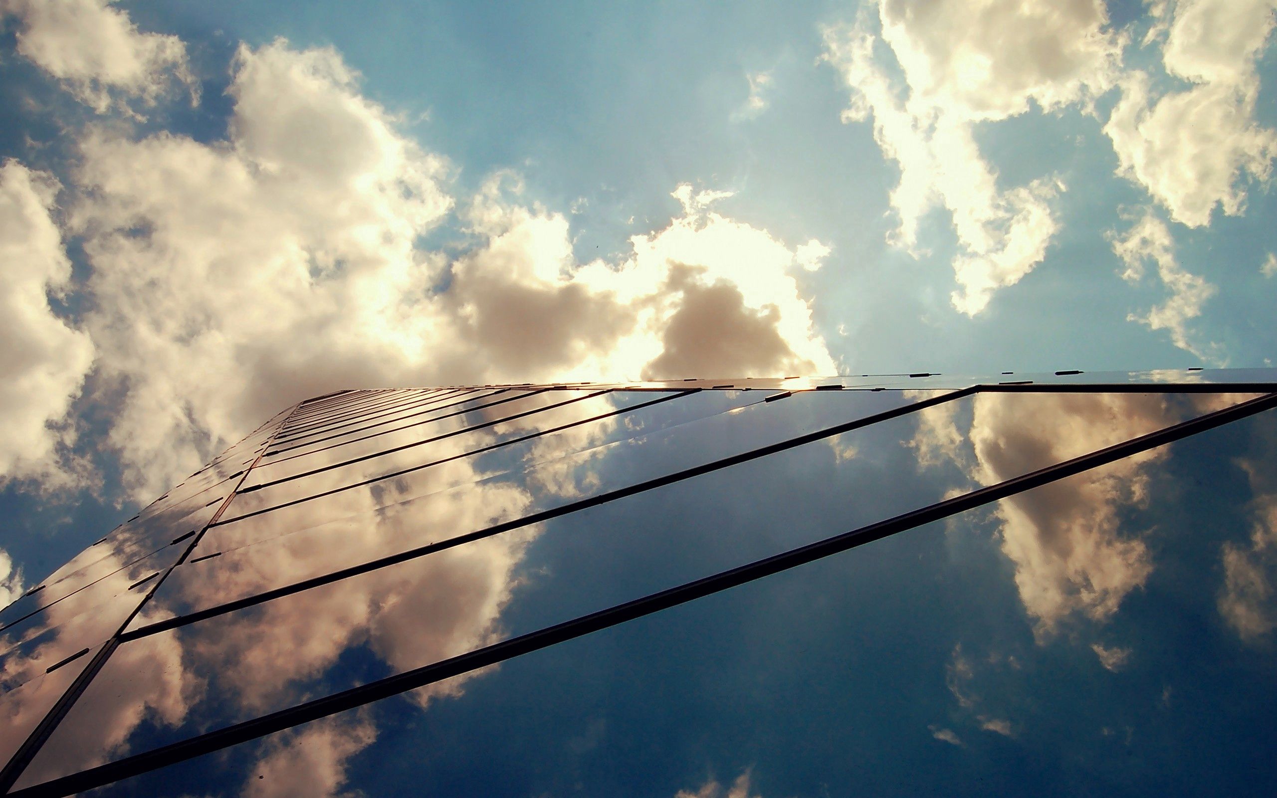 Download mobile wallpaper Cities, Clouds, Building, Glass, Shine, Light for free.