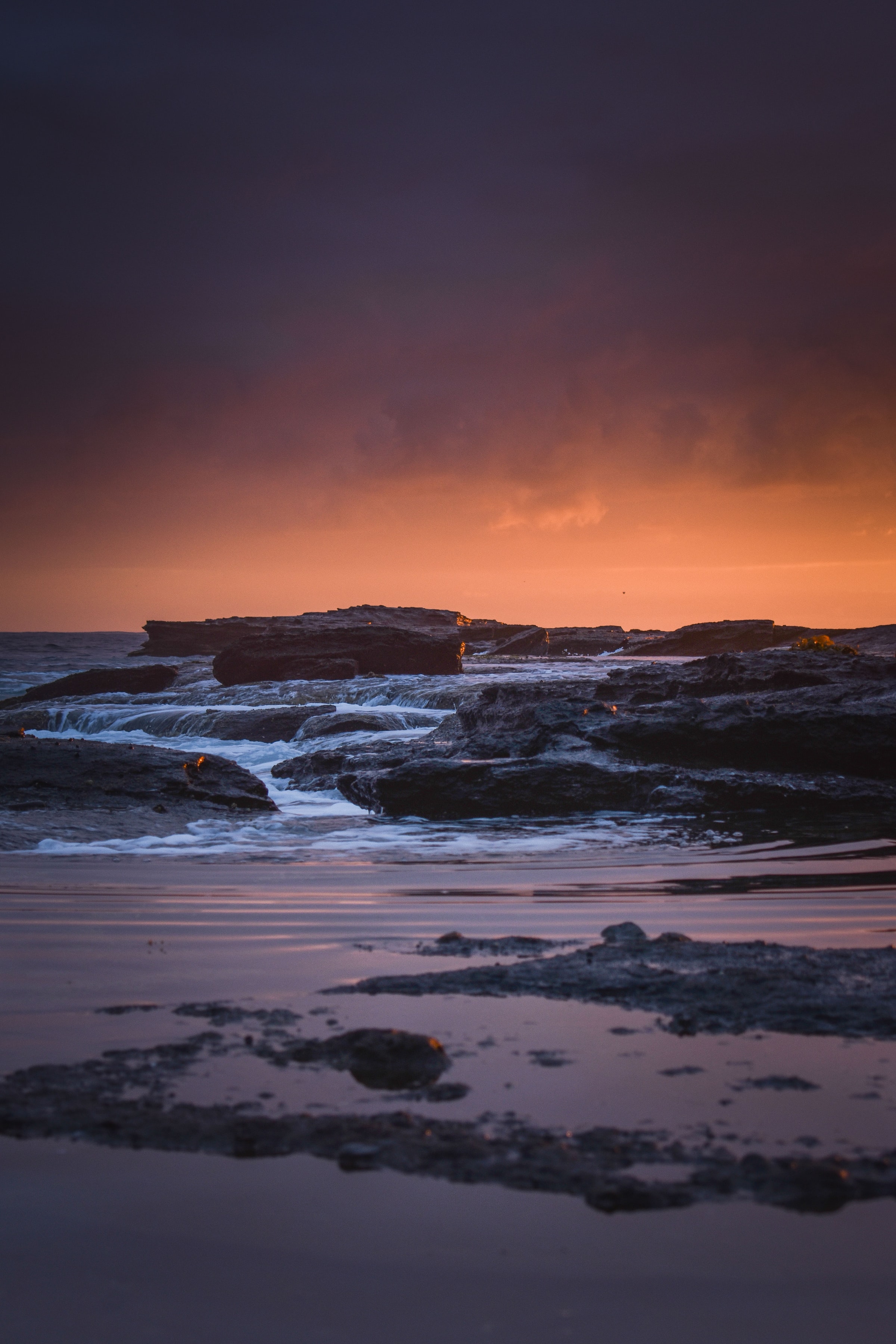 Download mobile wallpaper Rocks, Coast, Nature, Stones, Sunset, Sea for free.