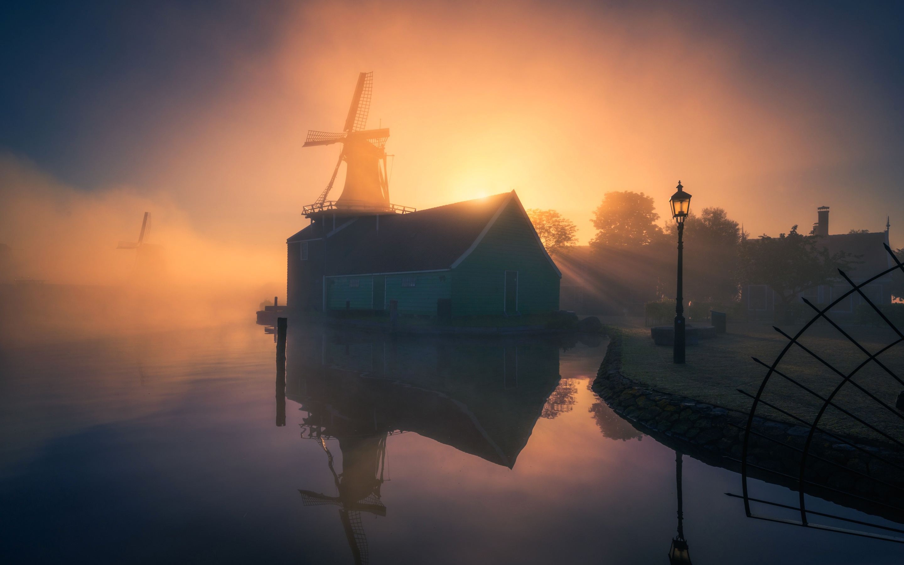 Free download wallpaper Building, Reflection, Fog, Sunrise, Windmill, Man Made on your PC desktop