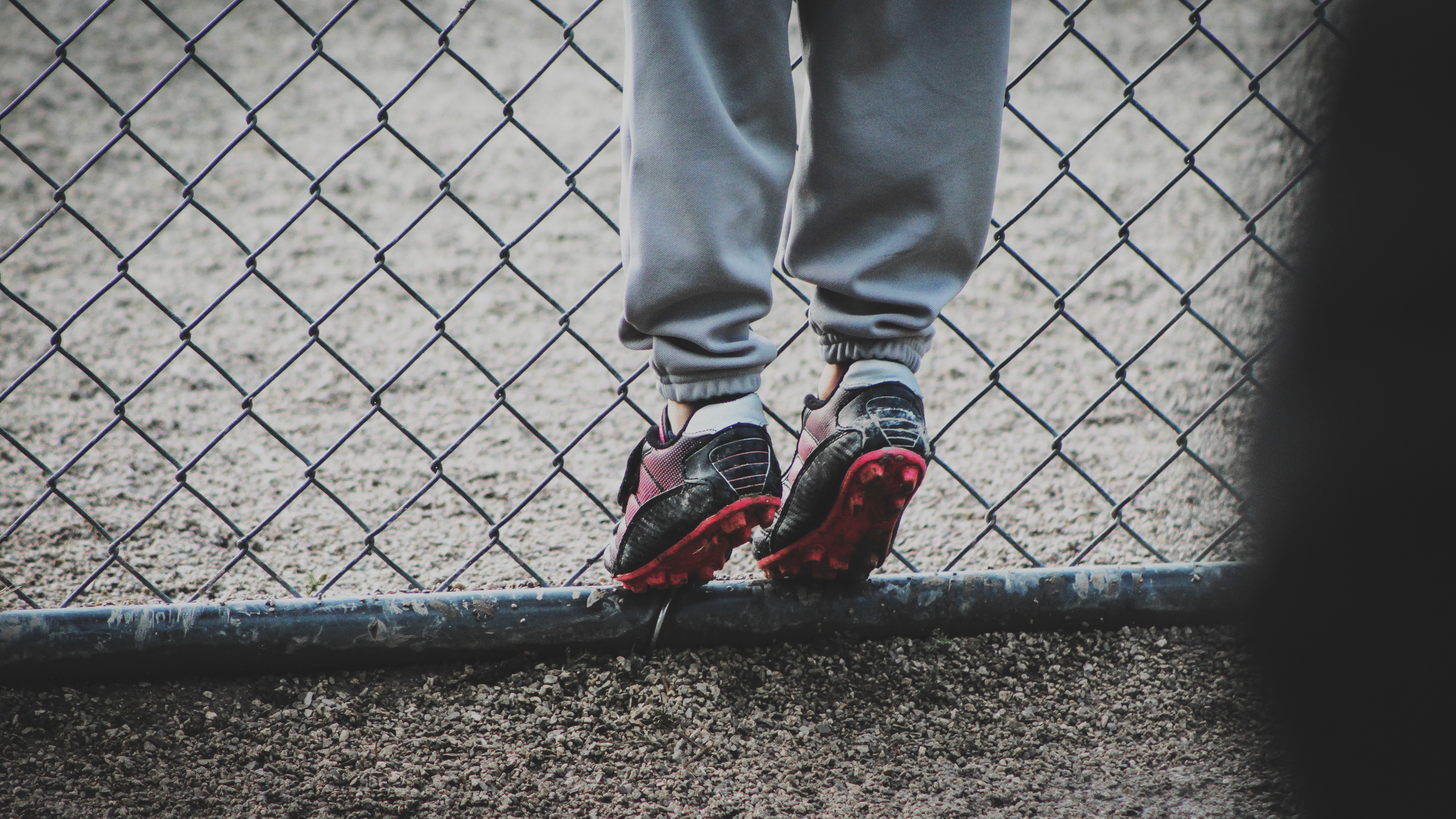 football, miscellanea, miscellaneous, legs, grid, fence, child, cleats, shoes