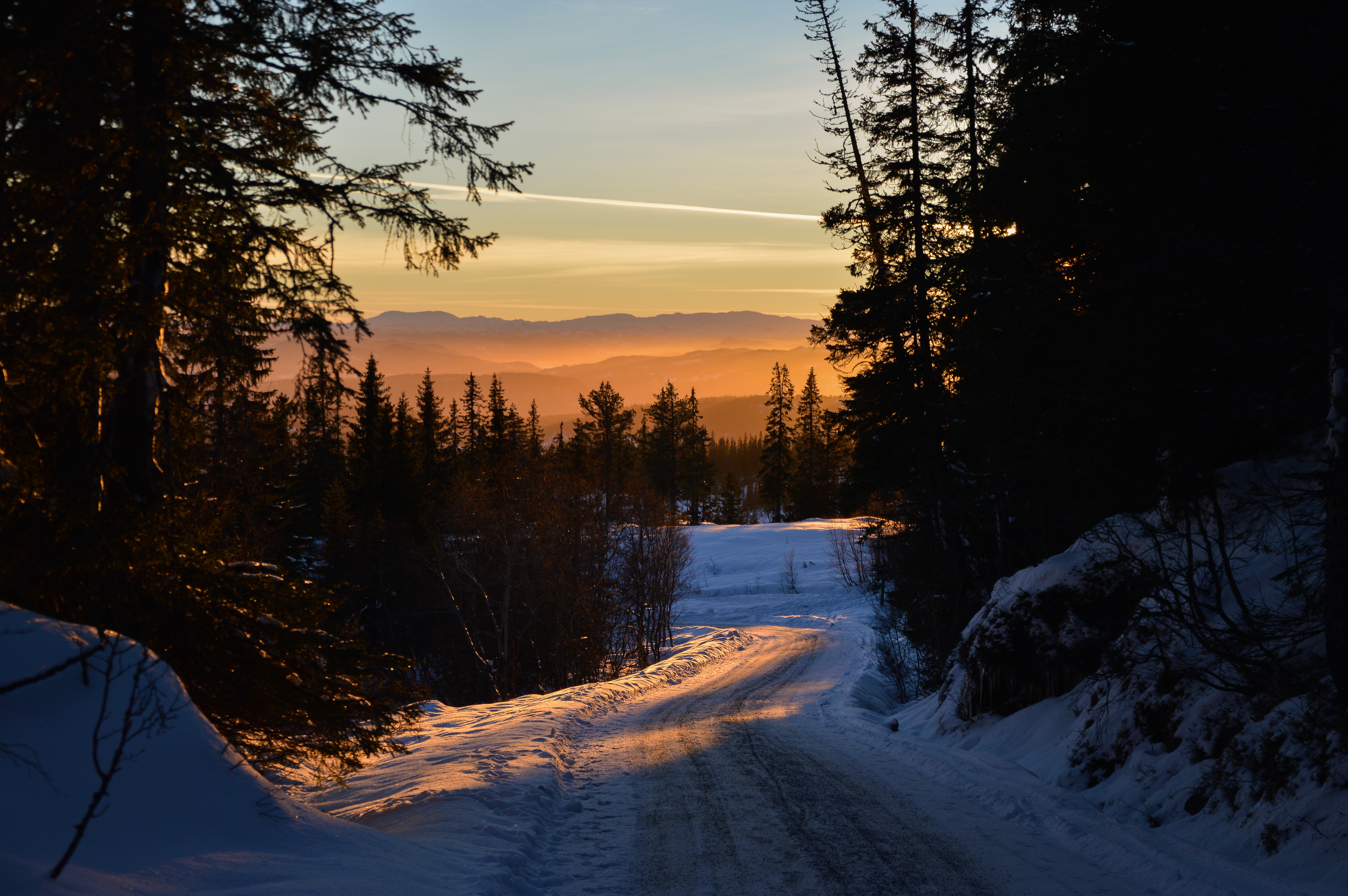Download mobile wallpaper Winter, Road, Forest, Trees, Nature, Sky, Sunset for free.