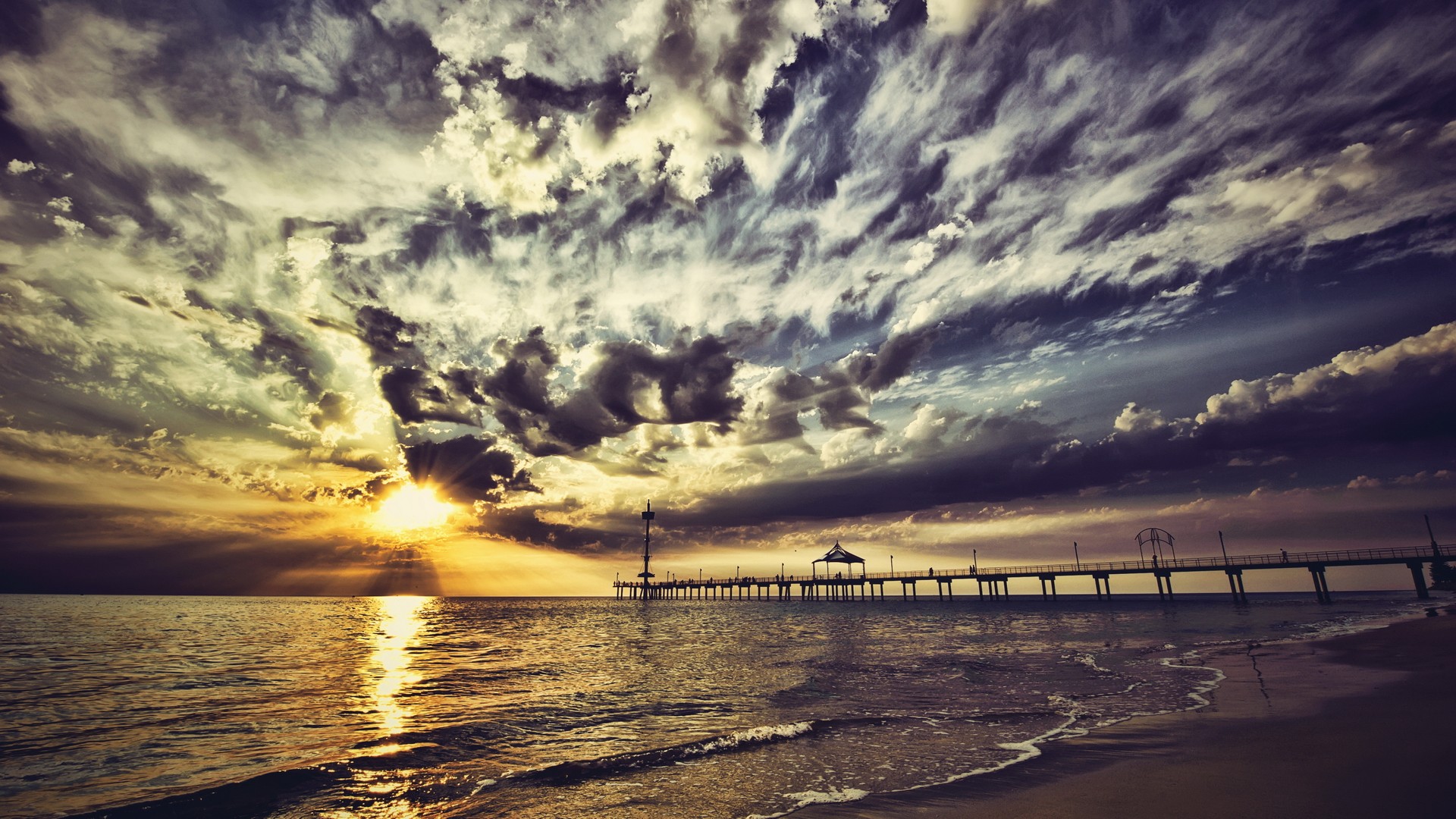 Download mobile wallpaper Sunset, Beach, Pier, Ocean, Sunlight, Cloud, Man Made for free.