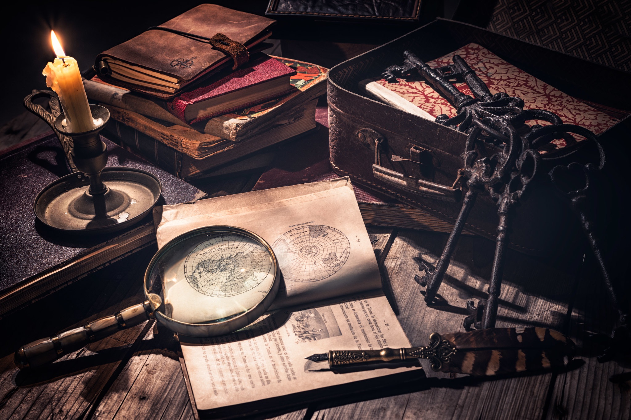 magnifying glass, photography, still life, book, candle, key, pen