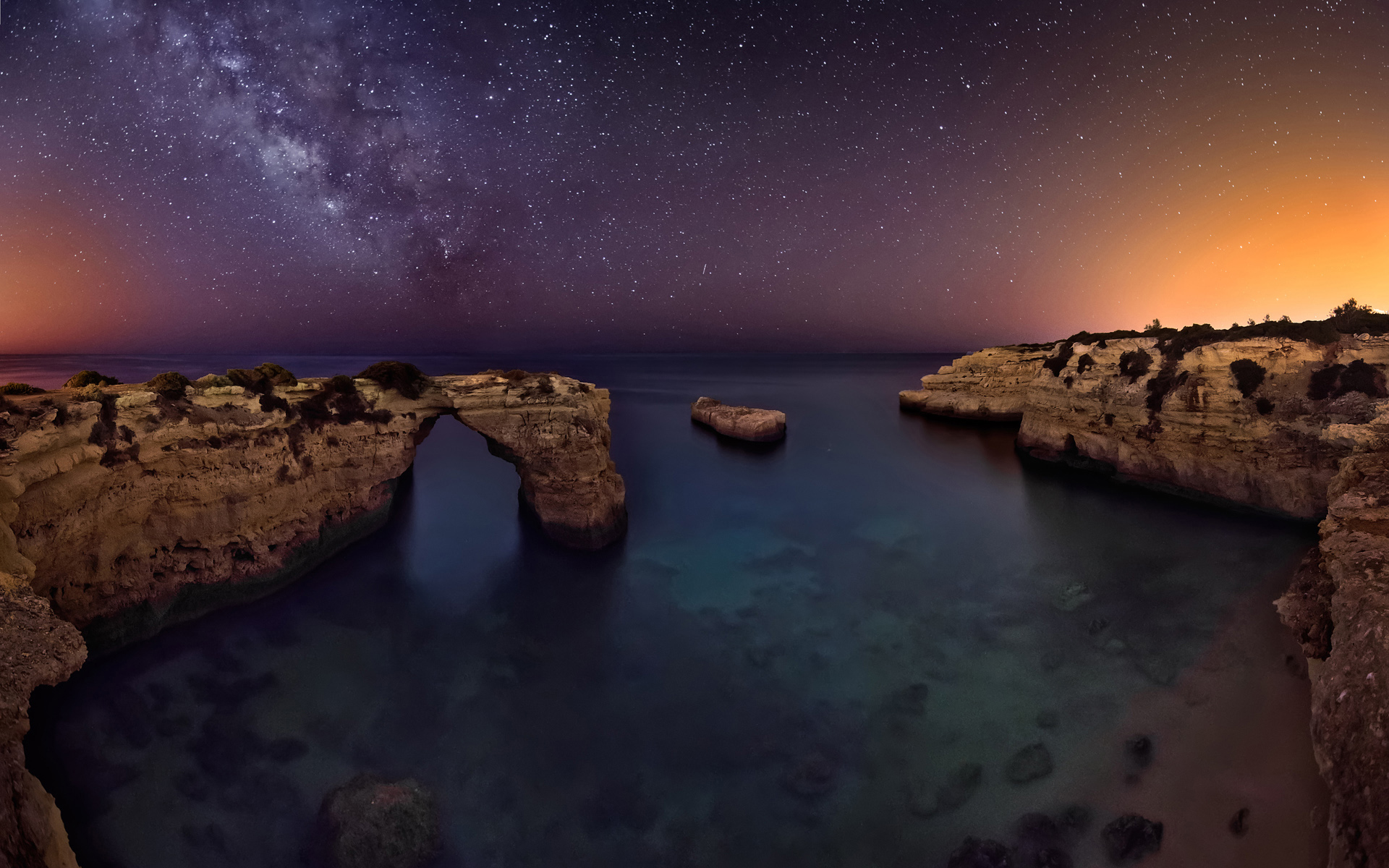Download mobile wallpaper Sky, Sea, Stars, Night, Horizon, Ocean, Starry Sky, Earth, Arch for free.