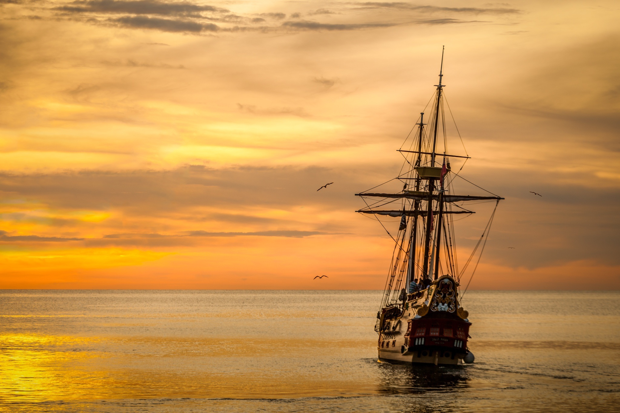 Download mobile wallpaper Sunset, Sky, Horizon, Ocean, Boat, Sailboat, Ship, Vehicles for free.