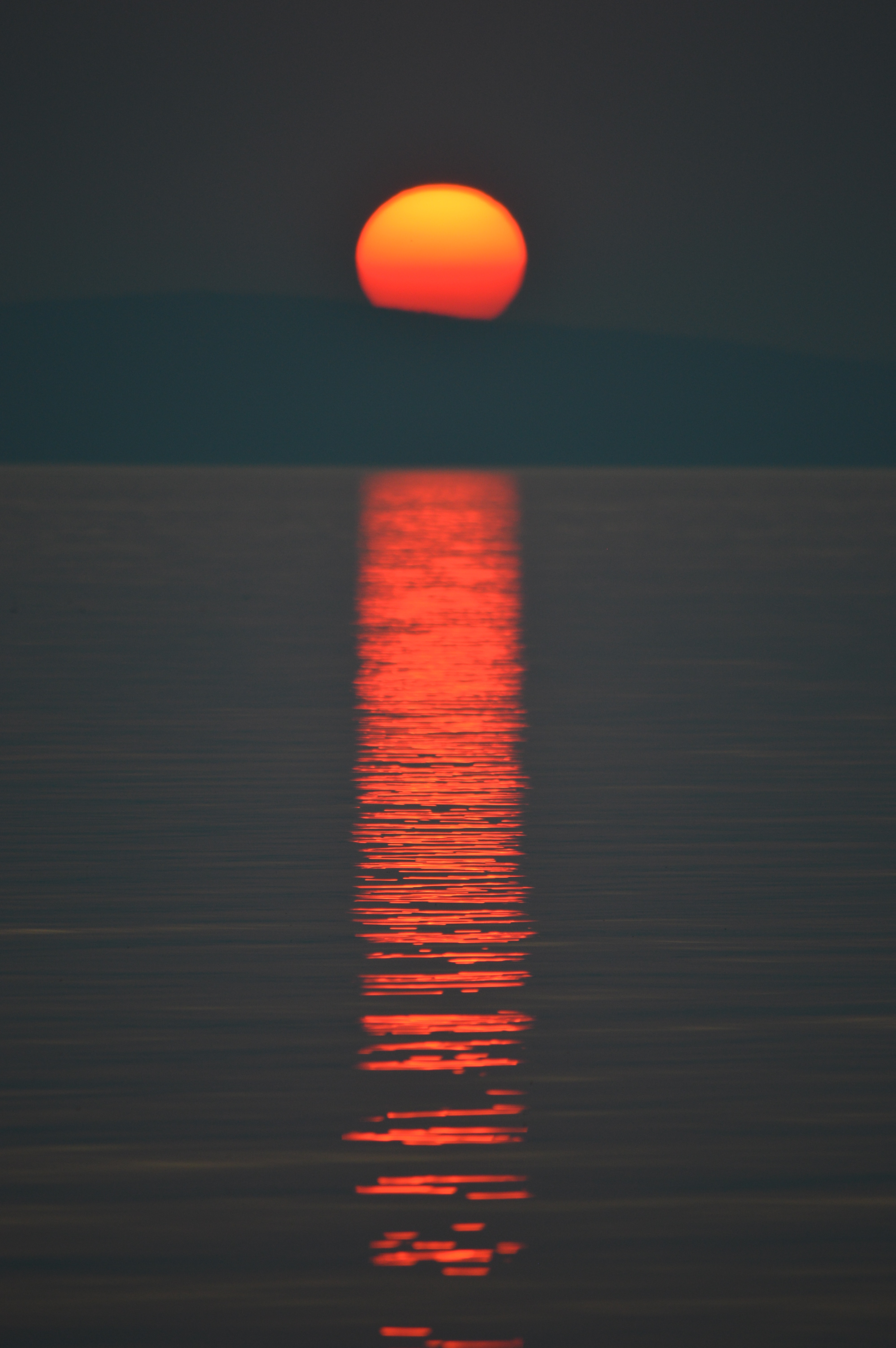 Download mobile wallpaper Reflection, Sunset, Water, Sun, Dark for free.