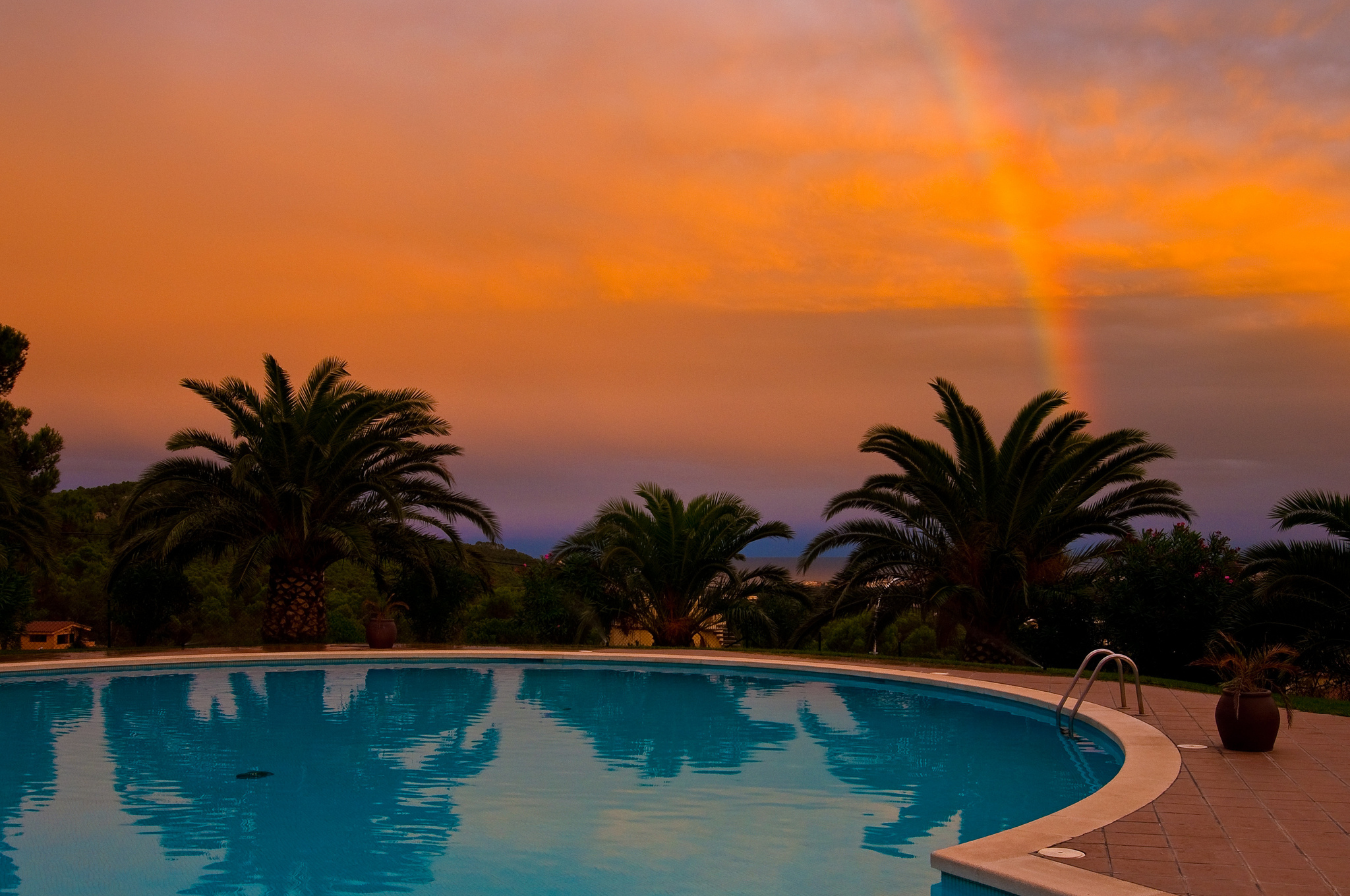 Download mobile wallpaper Sunset, Rainbow, Pool, Man Made, Palm Tree for free.