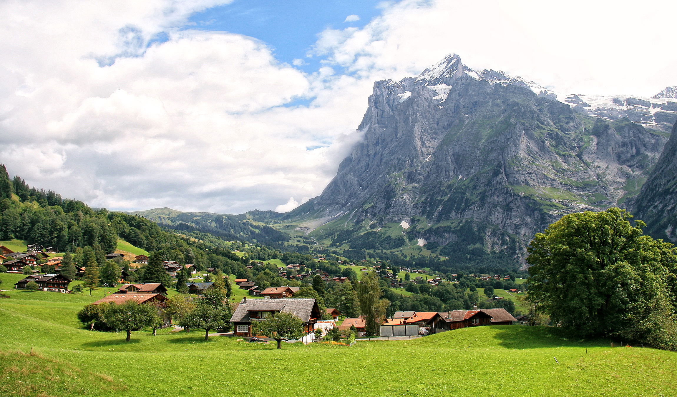 Download mobile wallpaper Landscape, Mountain, Tree, Field, Village, Switzerland, Cloud, Photography for free.