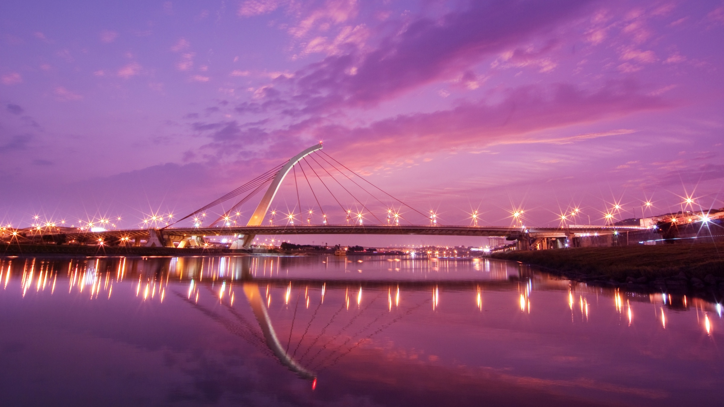 Download mobile wallpaper Bridges, Sunset, Sky, Pink, Reflection, Light, Bridge, Man Made for free.