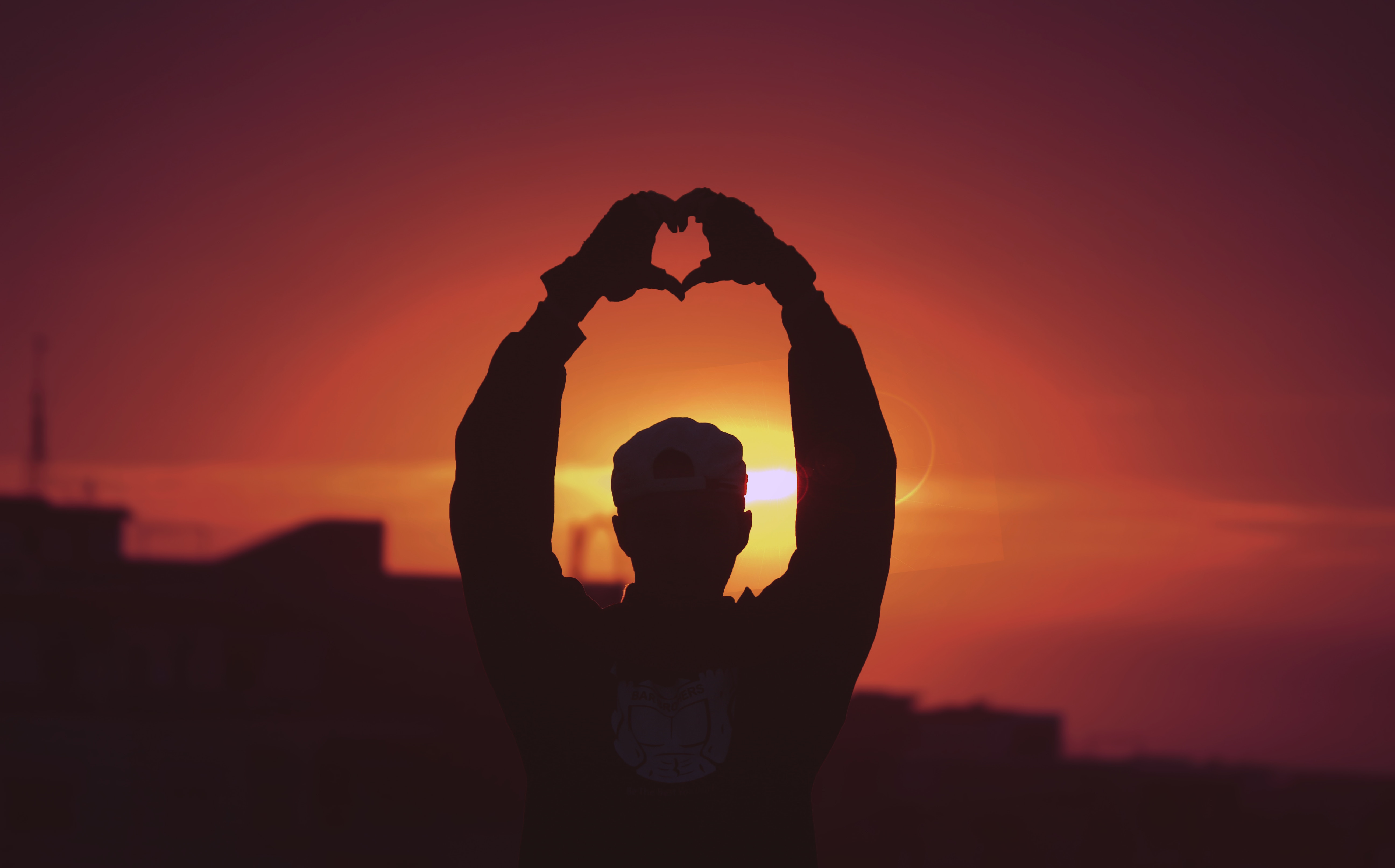 Download mobile wallpaper Person, Sunset, Silhouette, Human, Hands, Heart, Love for free.
