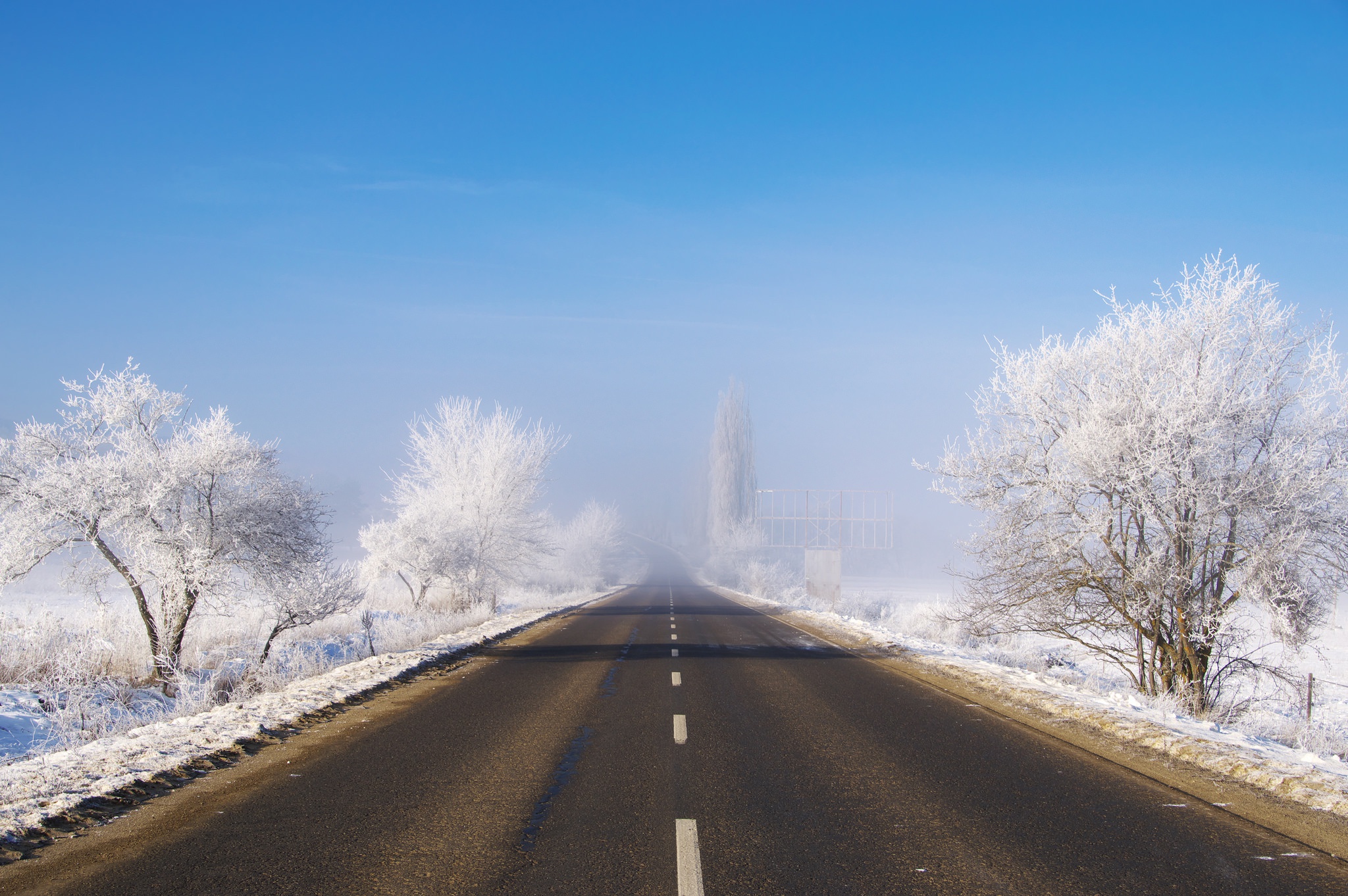 Download mobile wallpaper Winter, Sky, Snow, Road, Man Made for free.