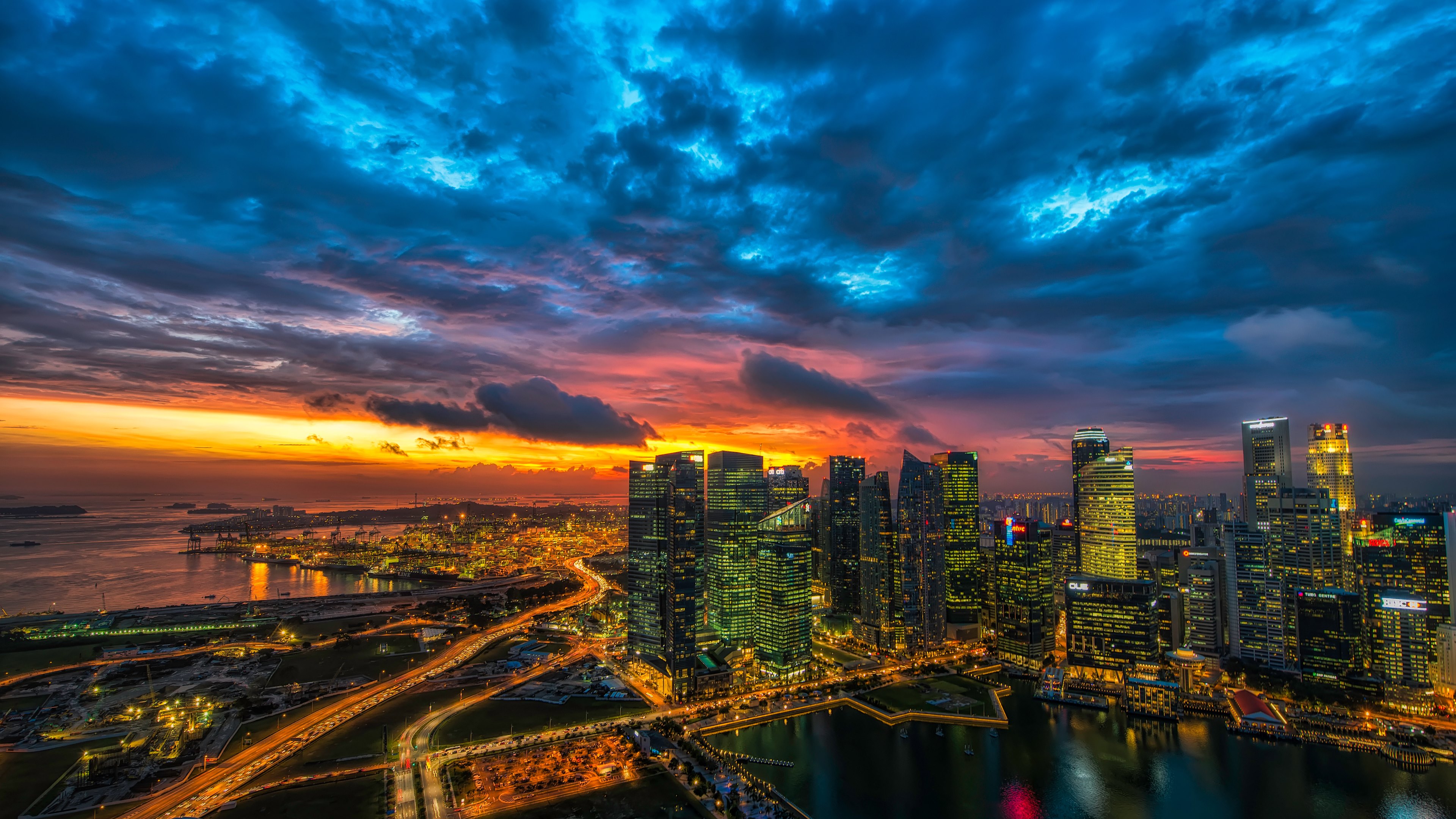 Скачать картинку Города, Закат, Ночь, Облака, Город, Свет, Городской Пейзаж, Сингапур, Сделано Человеком в телефон бесплатно.