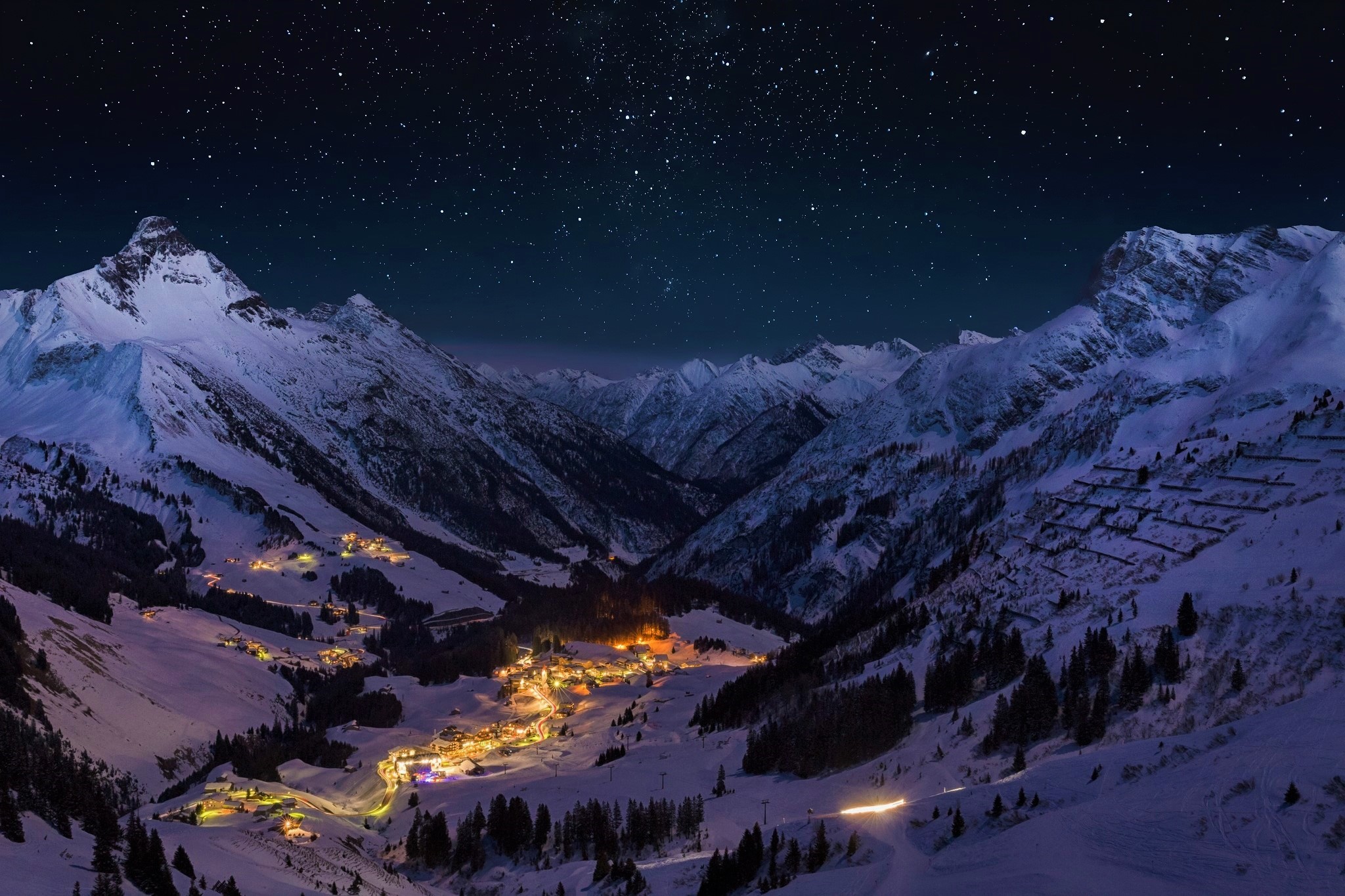 Free download wallpaper Winter, Night, Snow, Mountain, Light, Valley, Town, Man Made, Towns on your PC desktop