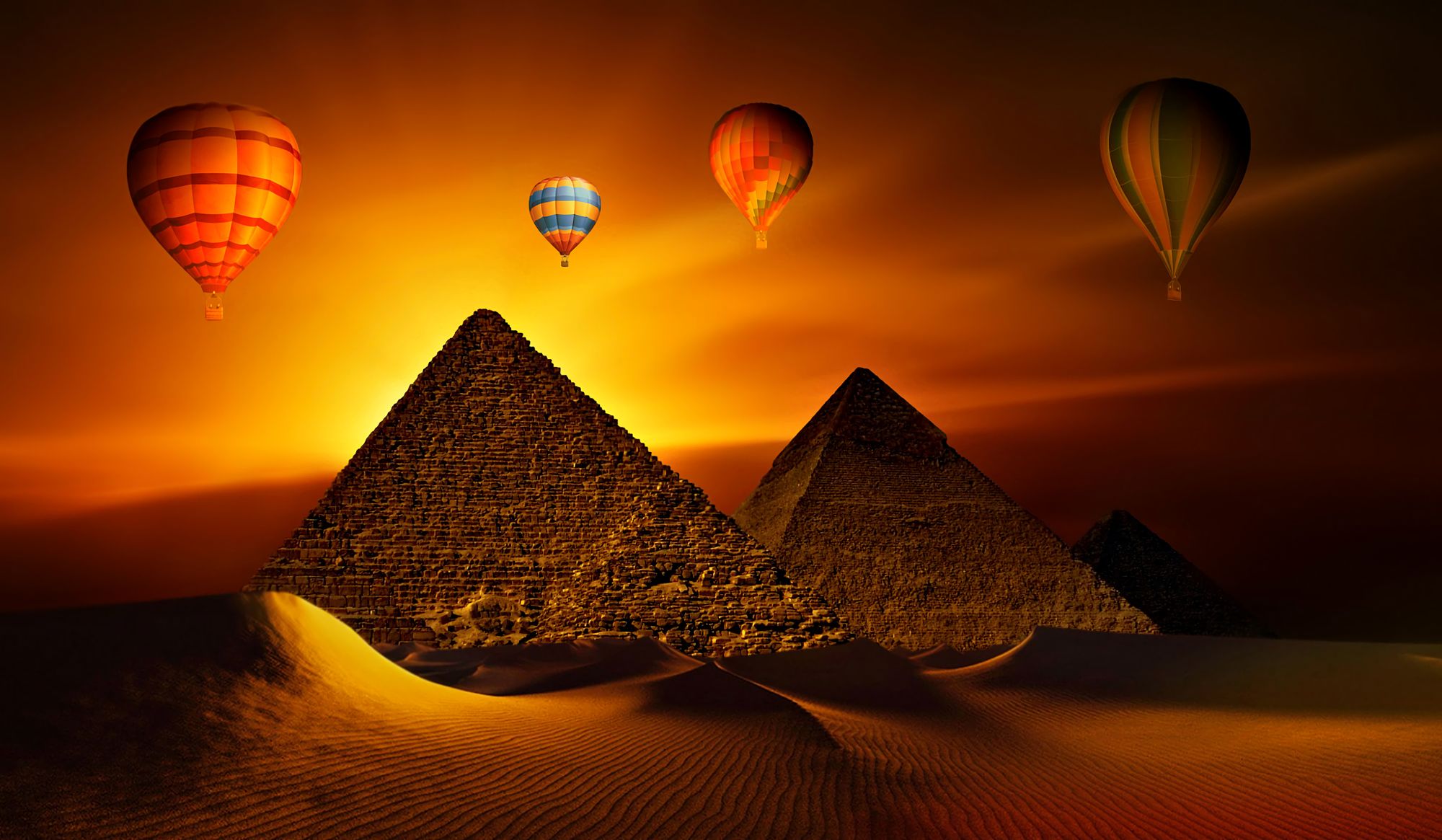 Download mobile wallpaper Sunset, Sky, Sand, Pyramid, Vehicles, Hot Air Balloon for free.