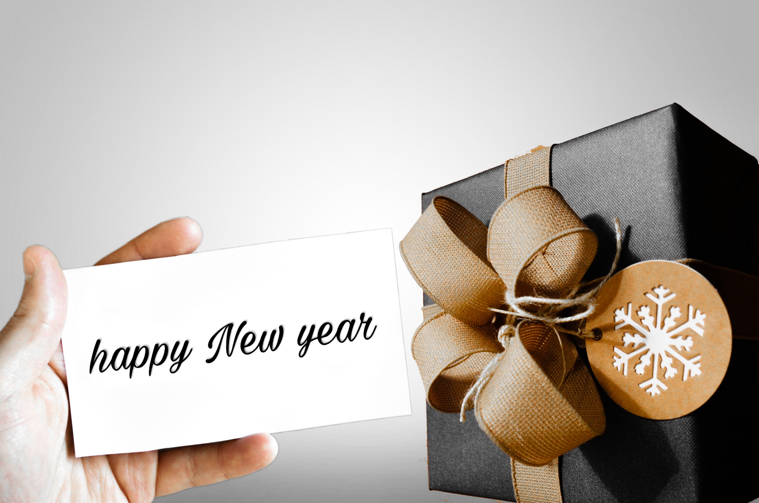 Download mobile wallpaper New Year, Hand, Christmas, Holiday, Gift for free.