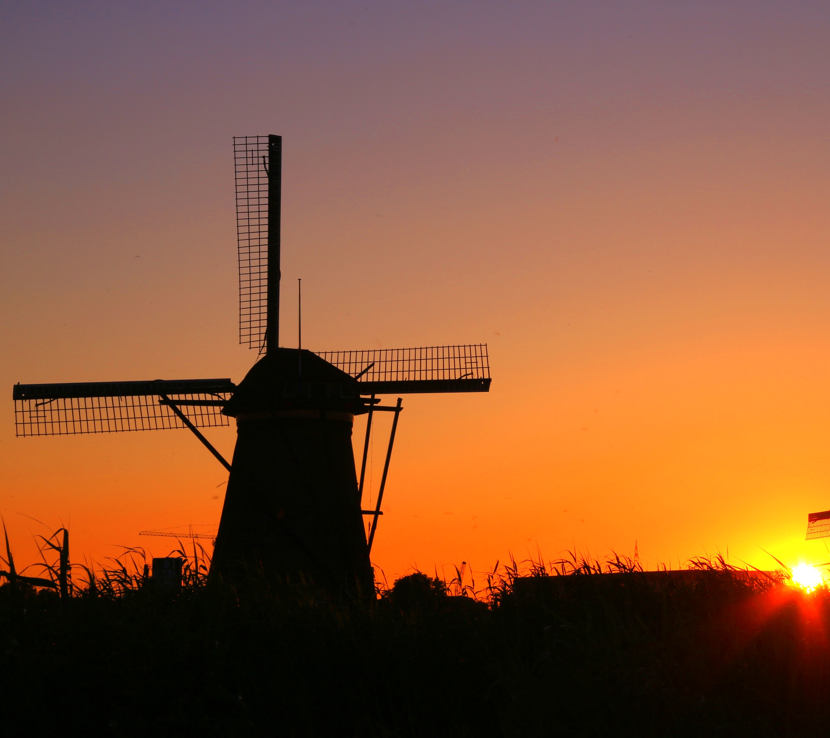 Download mobile wallpaper Sky, Building, Silhouette, Sunrise, Windmill, Man Made for free.