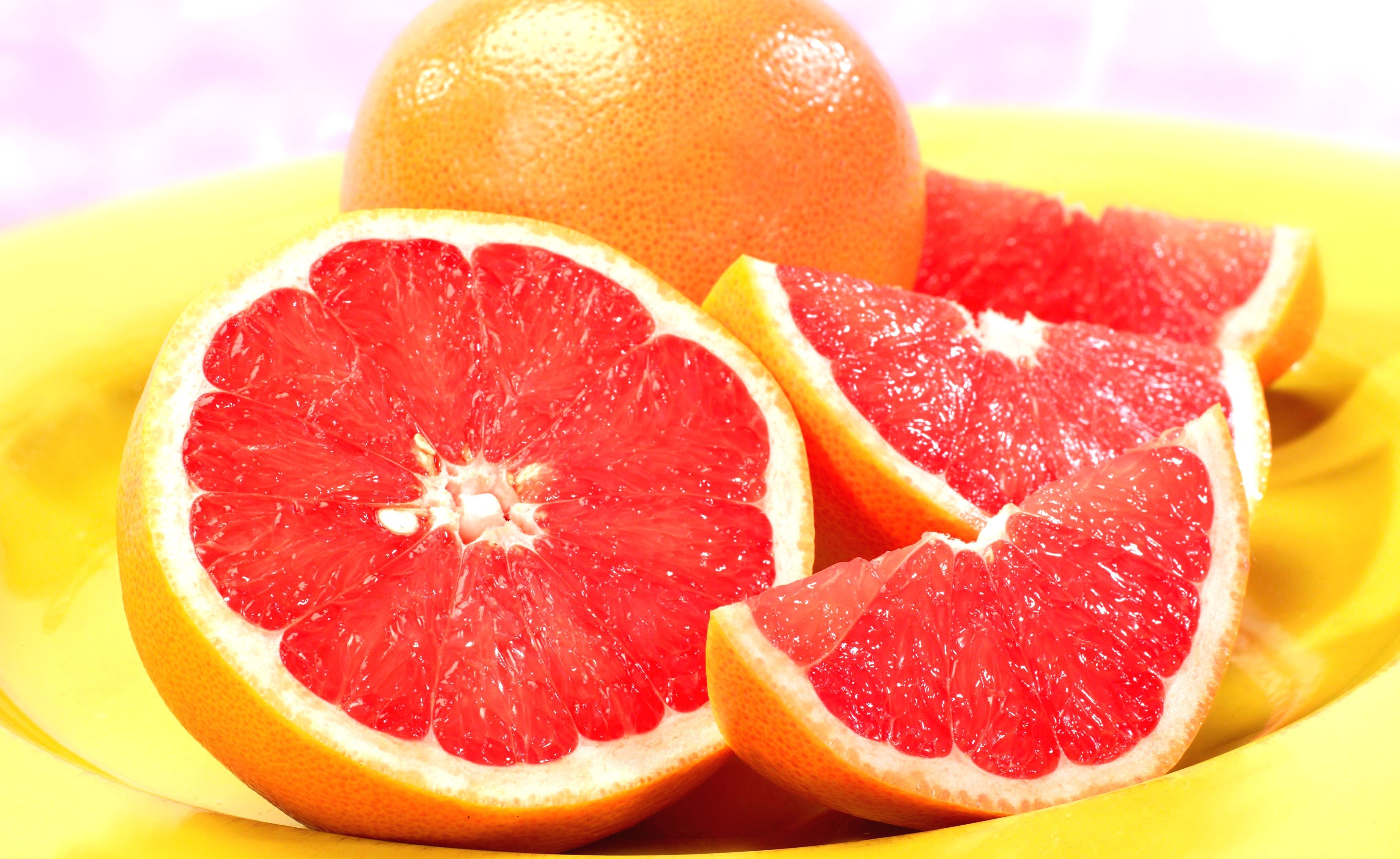 125237 завантажити шпалери грейпфрут, цитрусові, їжа, помаранчевий, оранжевий, часточки, фрагменти - заставки і картинки безкоштовно