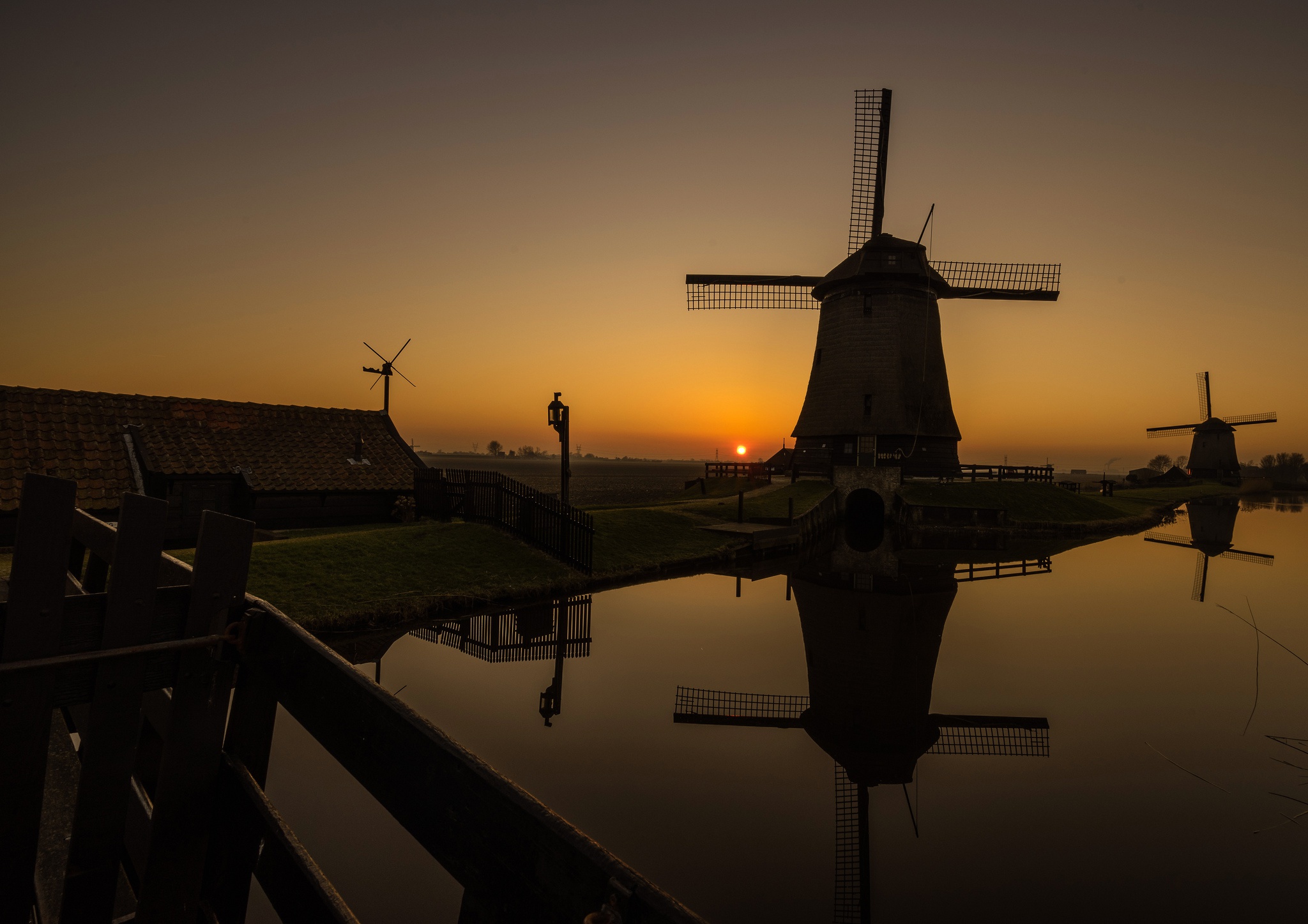 Download mobile wallpaper Night, Building, Reflection, Windmill, Man Made for free.