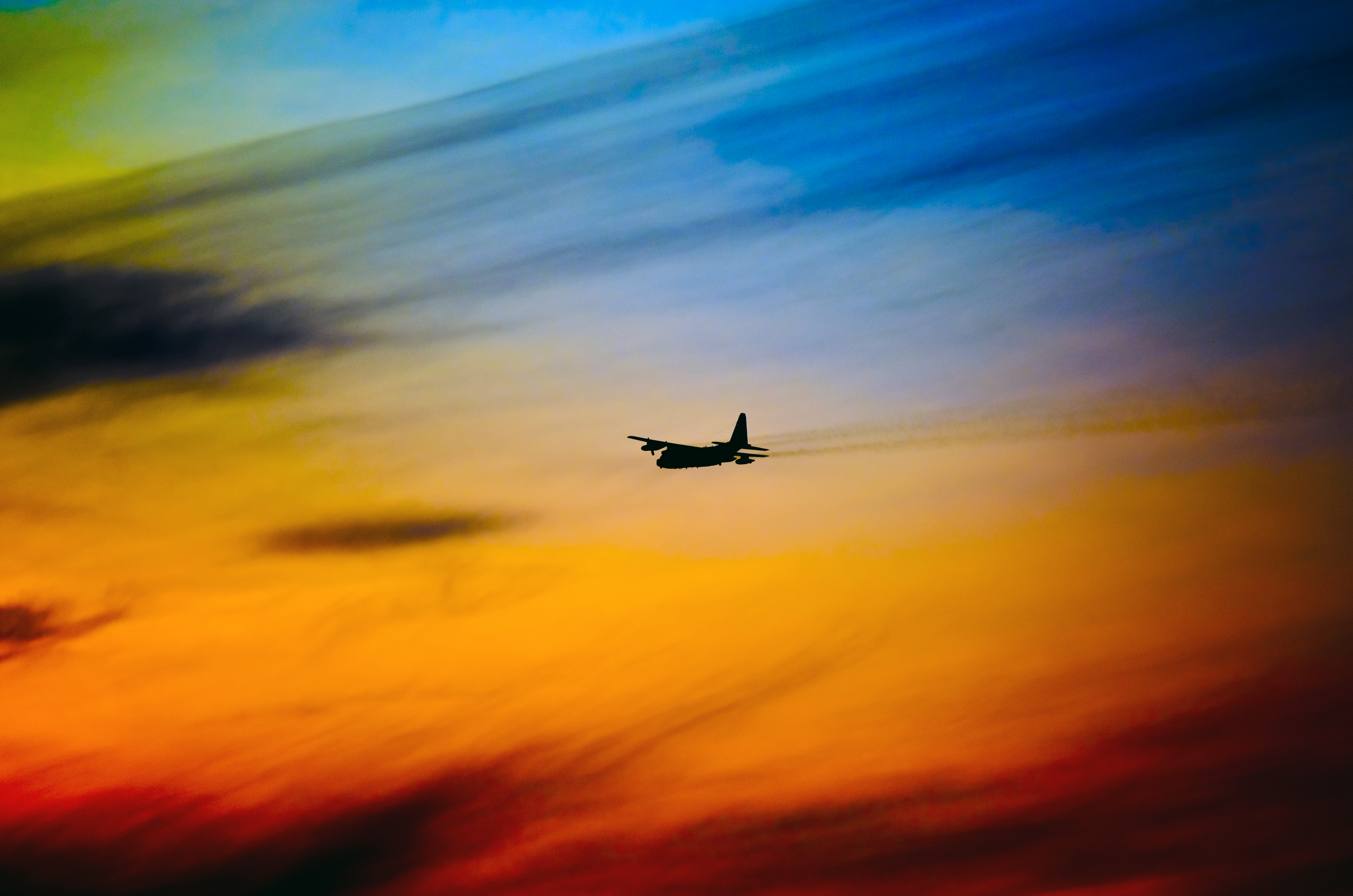 Free download wallpaper Sky, Miscellanea, Miscellaneous, Motley, Silhouette, Multicolored, Airplane, Plane on your PC desktop
