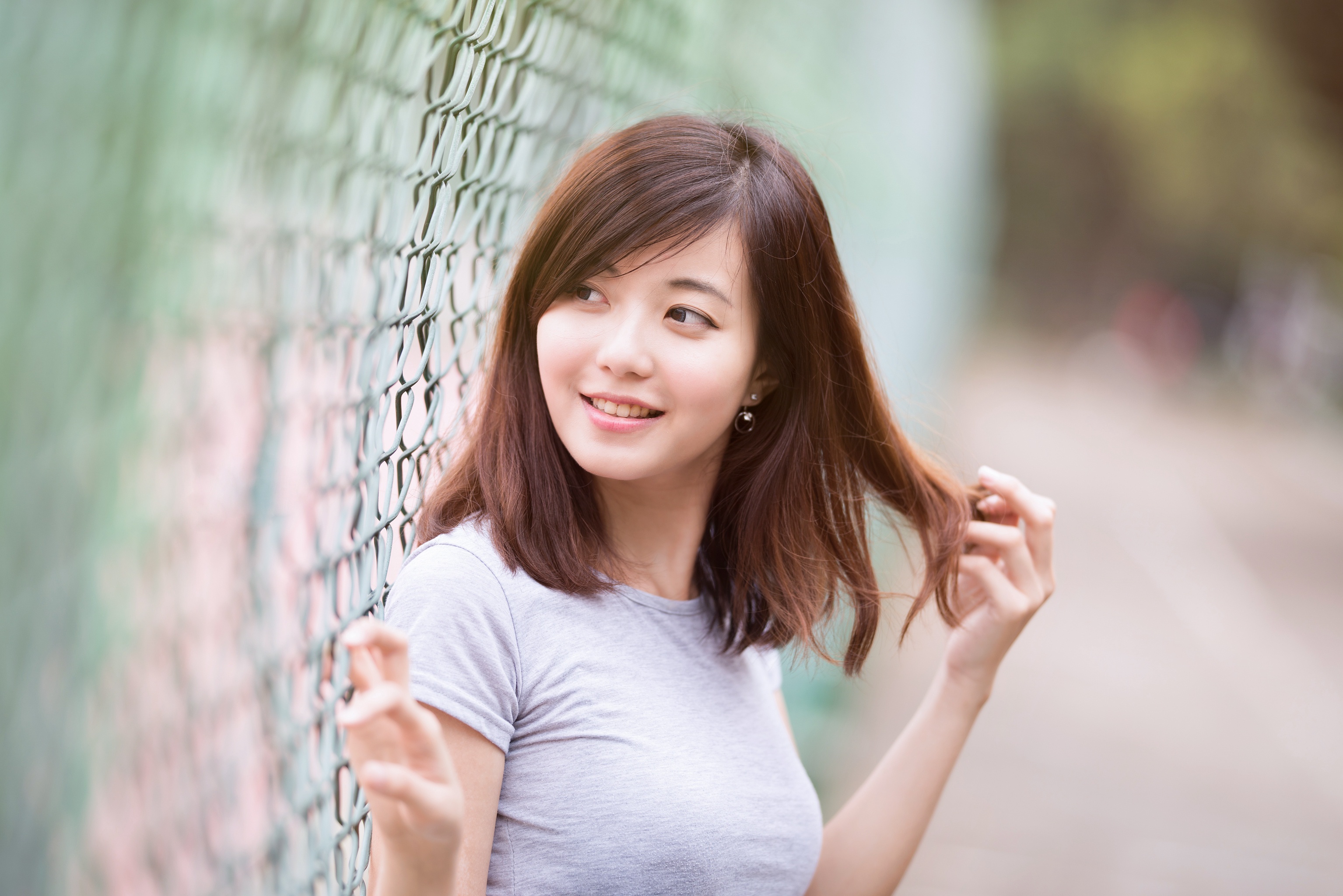 Download mobile wallpaper Blur, Fence, Smile, Brunette, Model, Women, Asian for free.