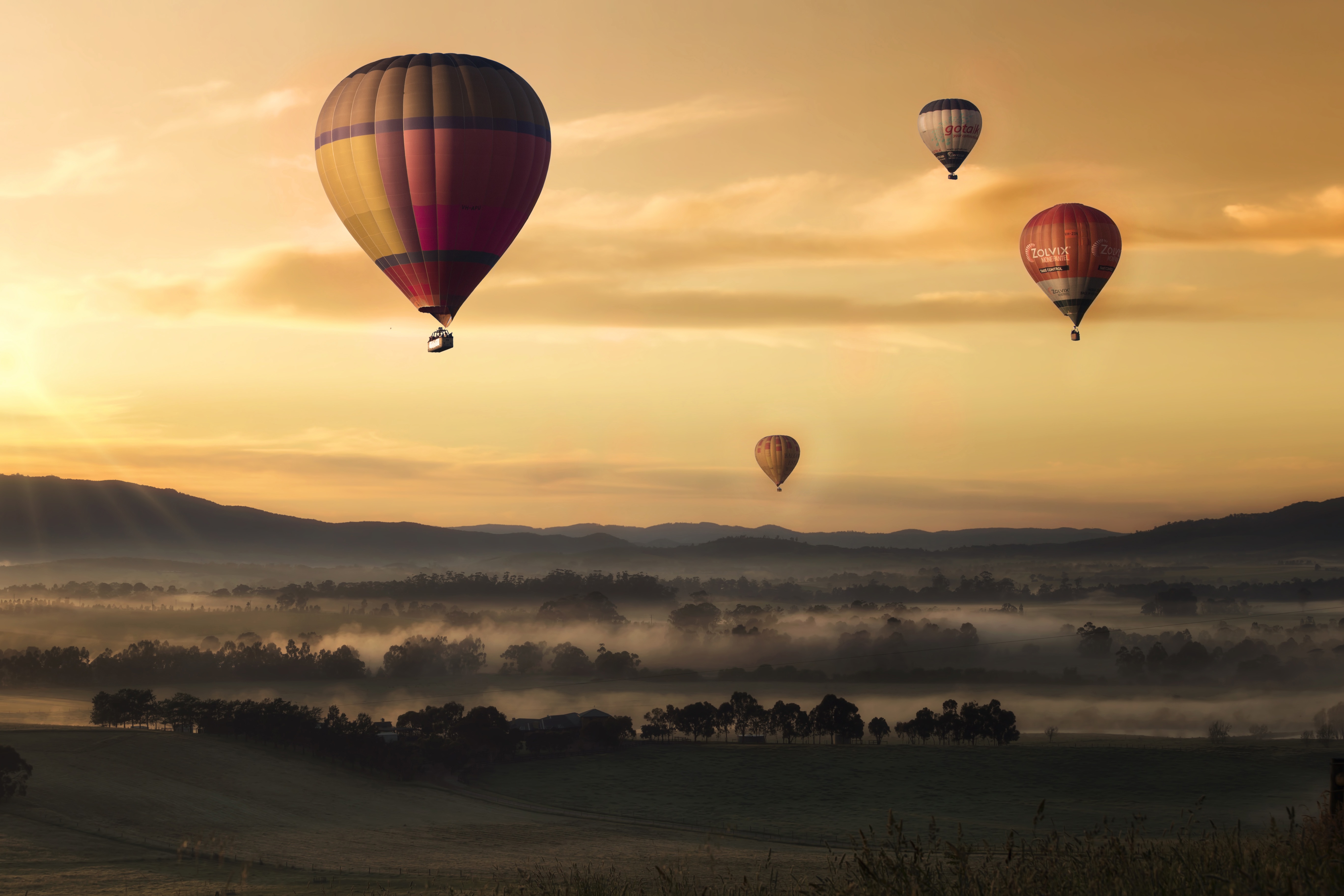Free download wallpaper Nature, Sunset, Sky, Fog, Field, Balloons on your PC desktop