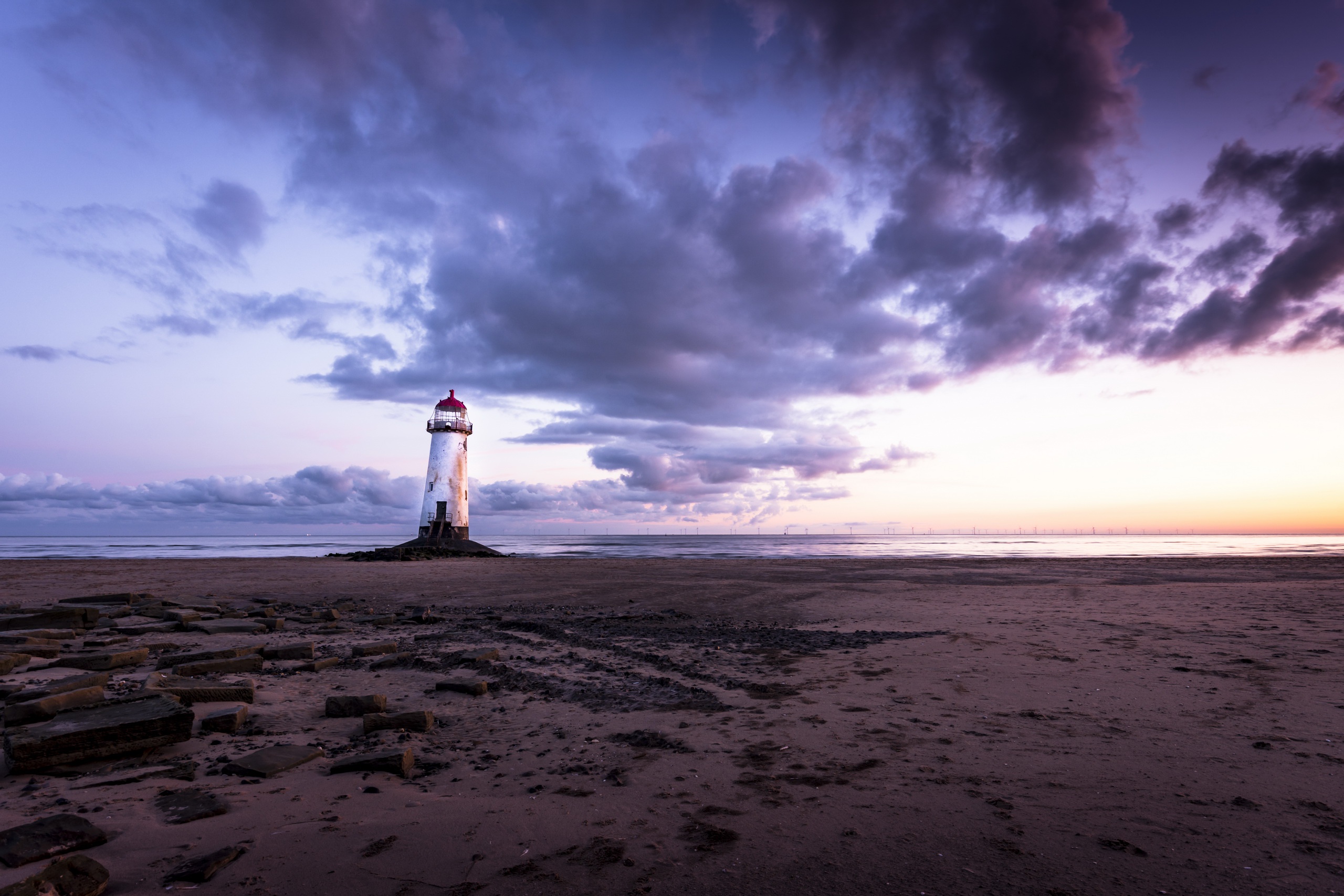 Download mobile wallpaper Sunset, Horizon, Ocean, Lighthouse, Cloud, Wales, Man Made for free.