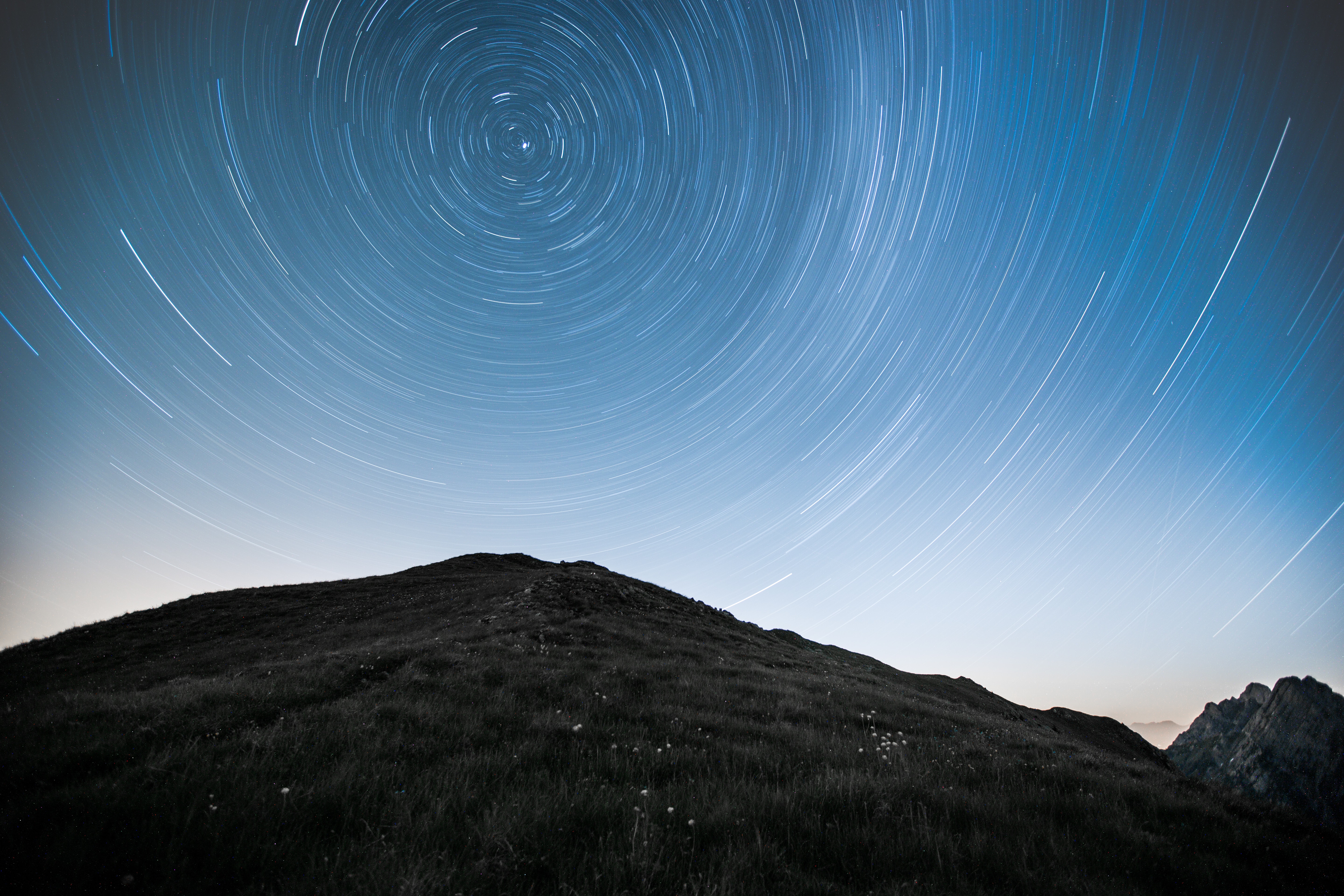Download mobile wallpaper Traffic, Movement, Long Exposure, Hill, Mountains, Nature, Stars, Starry Sky for free.