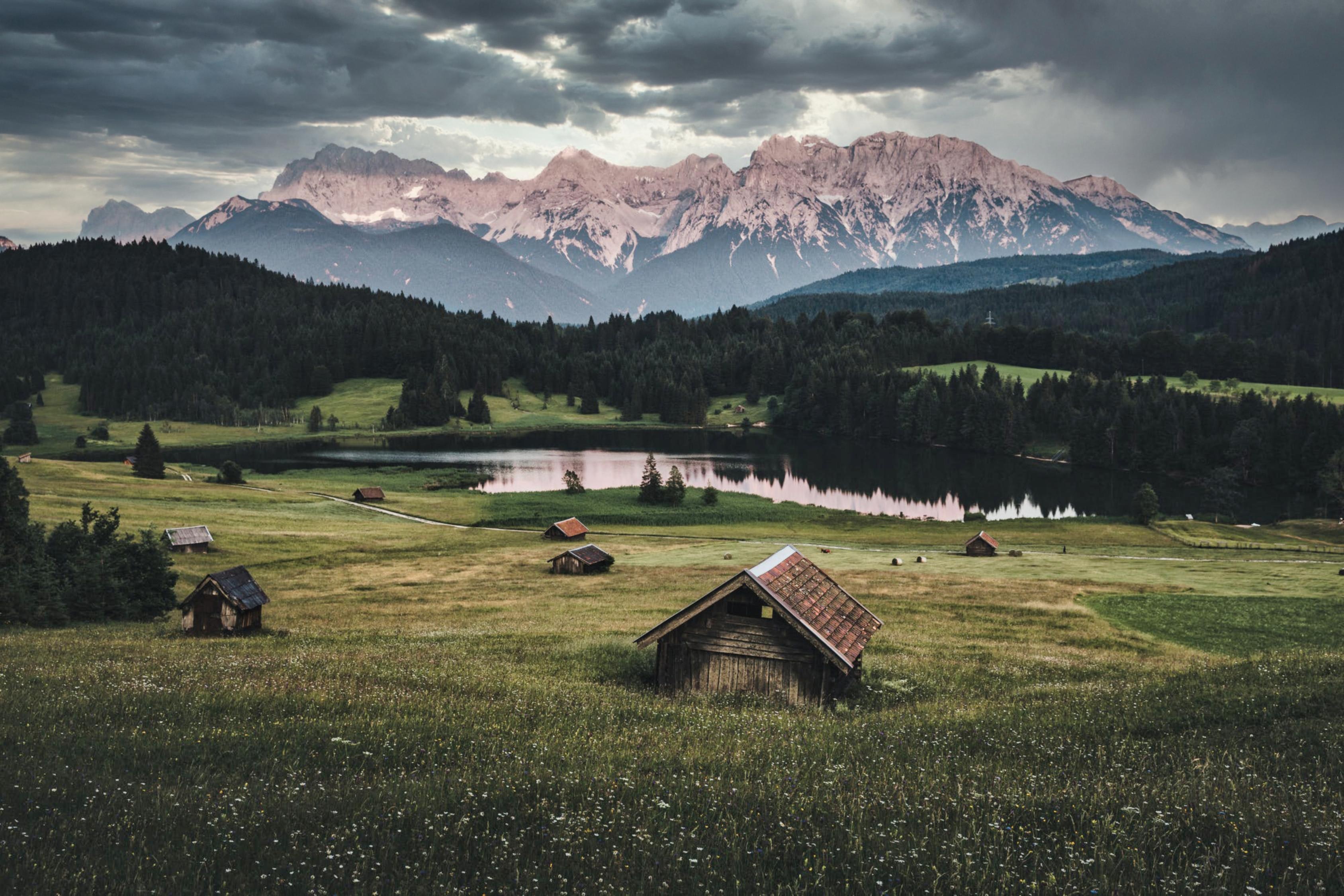 Free download wallpaper Nature, Lake, Lawn, Small Houses, Mountains, Houses on your PC desktop