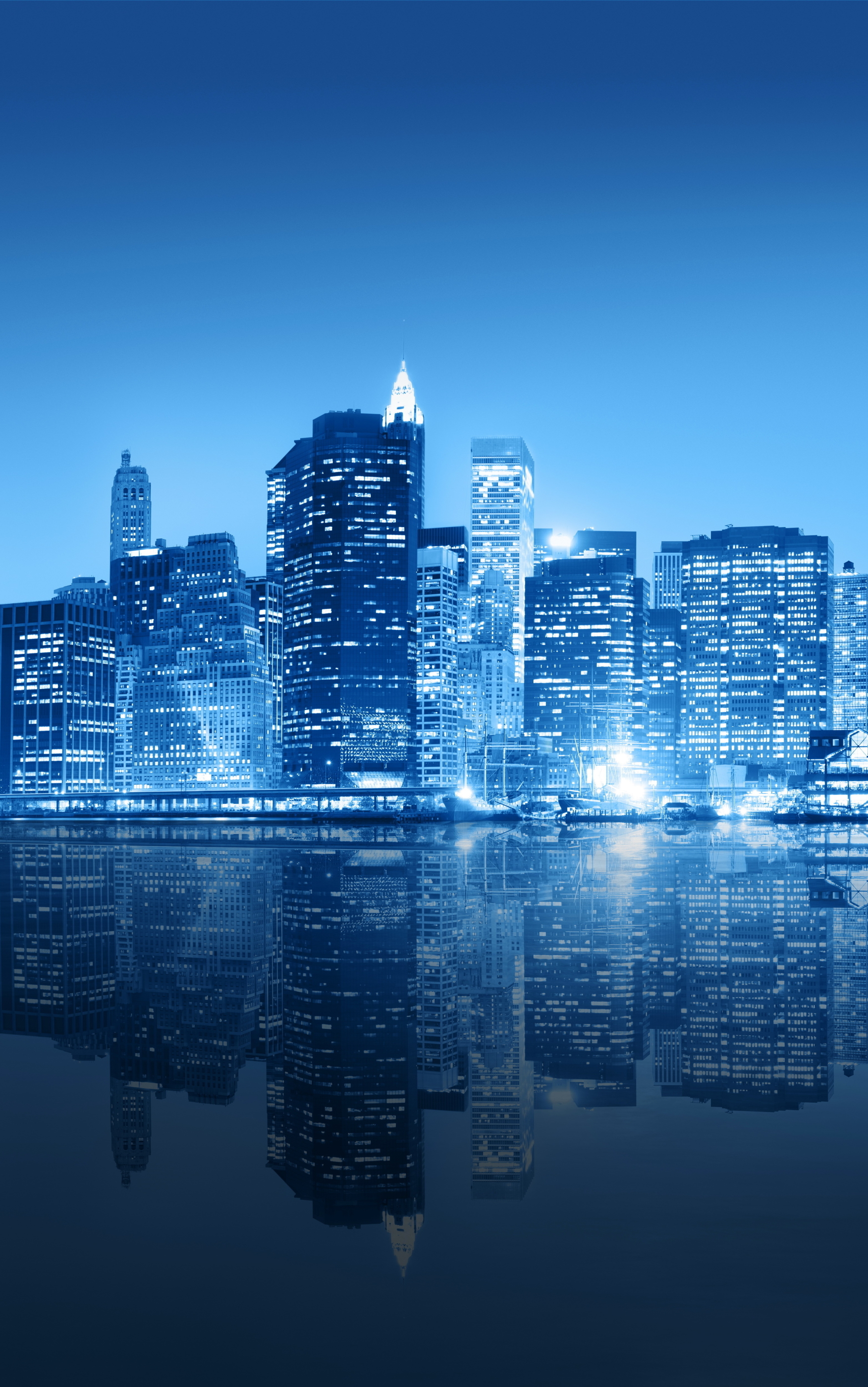 Download mobile wallpaper Cities, Night, City, Skyscraper, Building, Reflection, New York, Manhattan, Man Made for free.