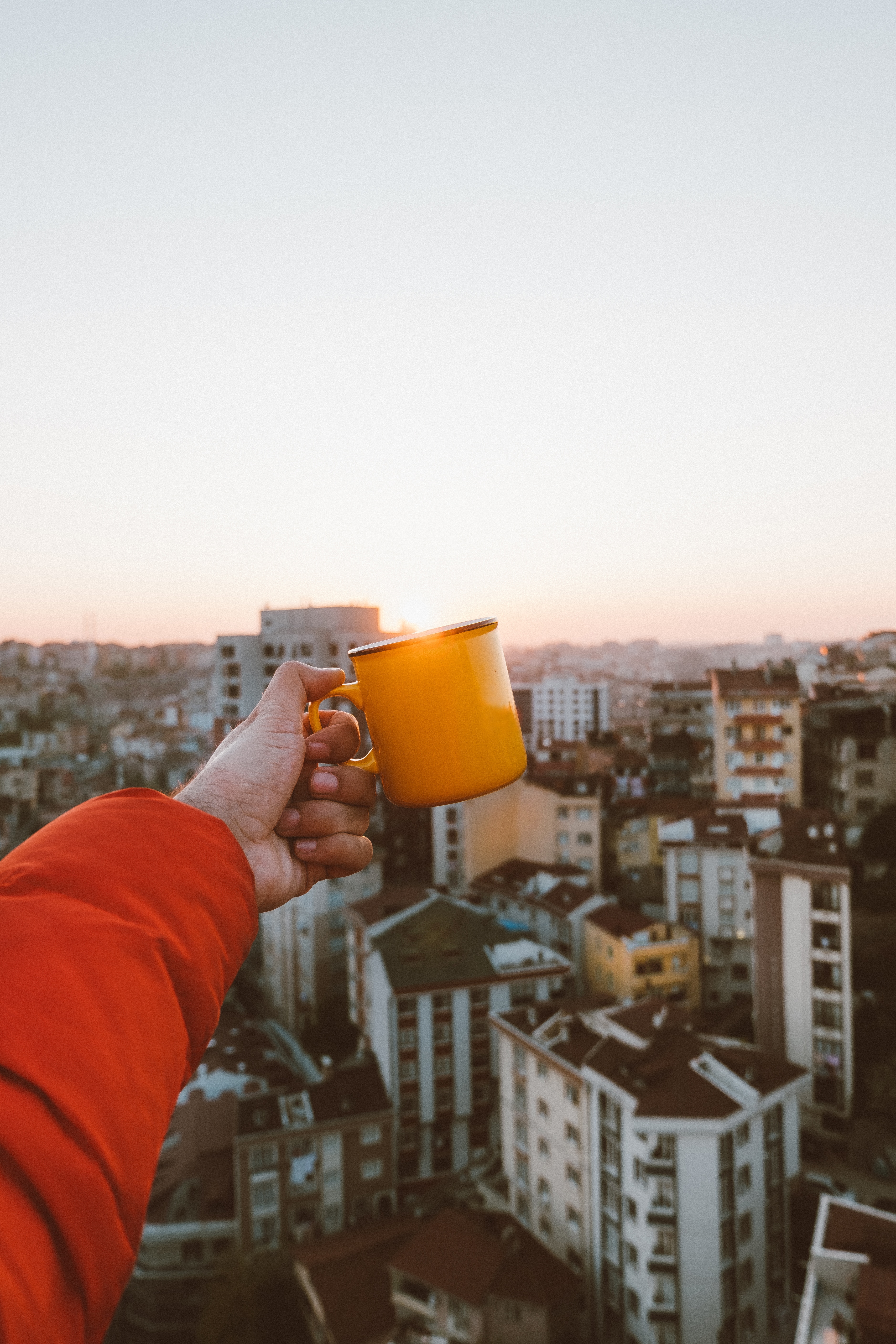 Free download wallpaper Miscellanea, Miscellaneous, Roof, Roofs, Mug, City, Hand, Cup, Rising Sun, Dawn on your PC desktop