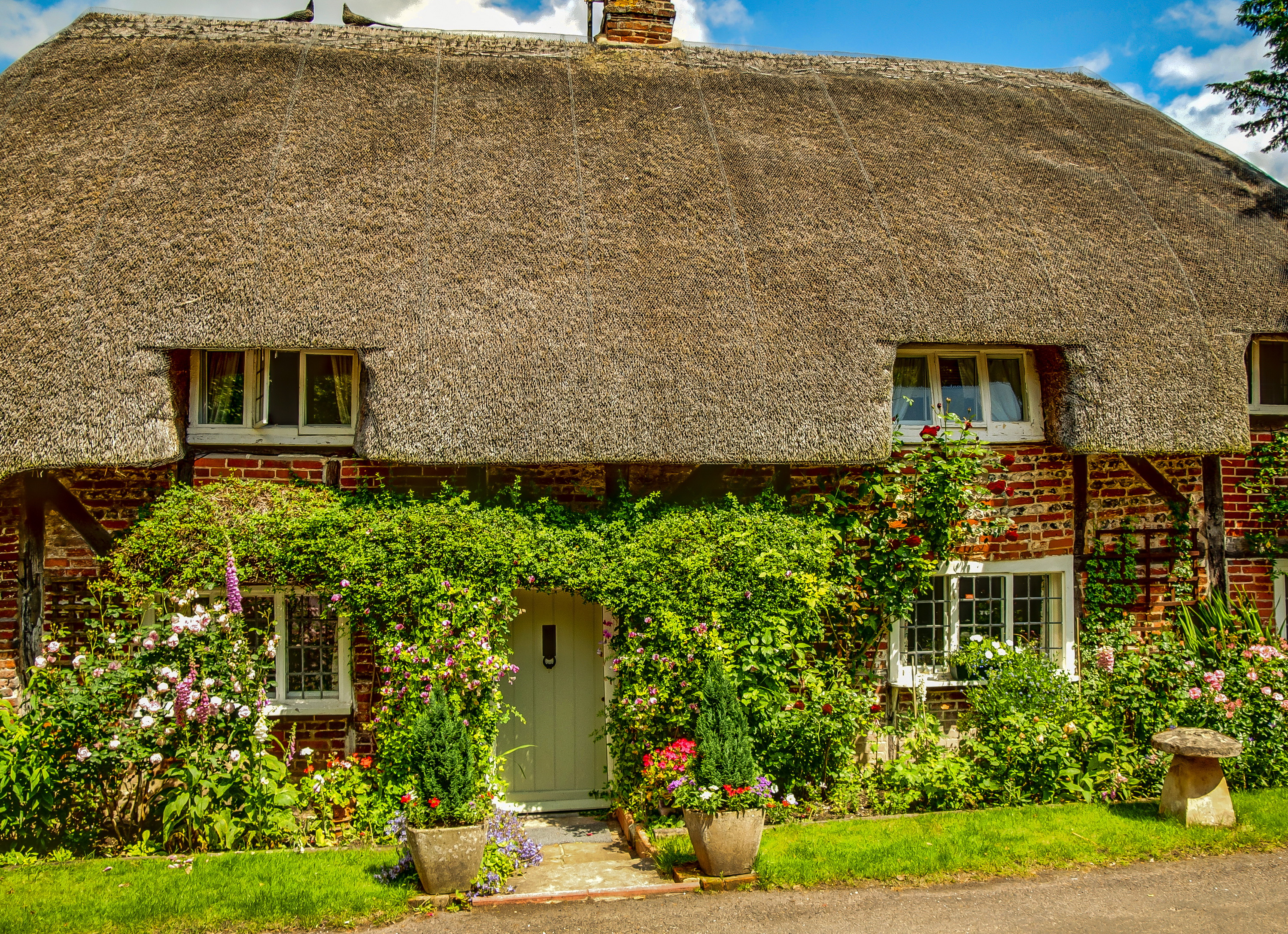 Free download wallpaper Flower, House, Spring, England, Man Made, Thatched Roof on your PC desktop