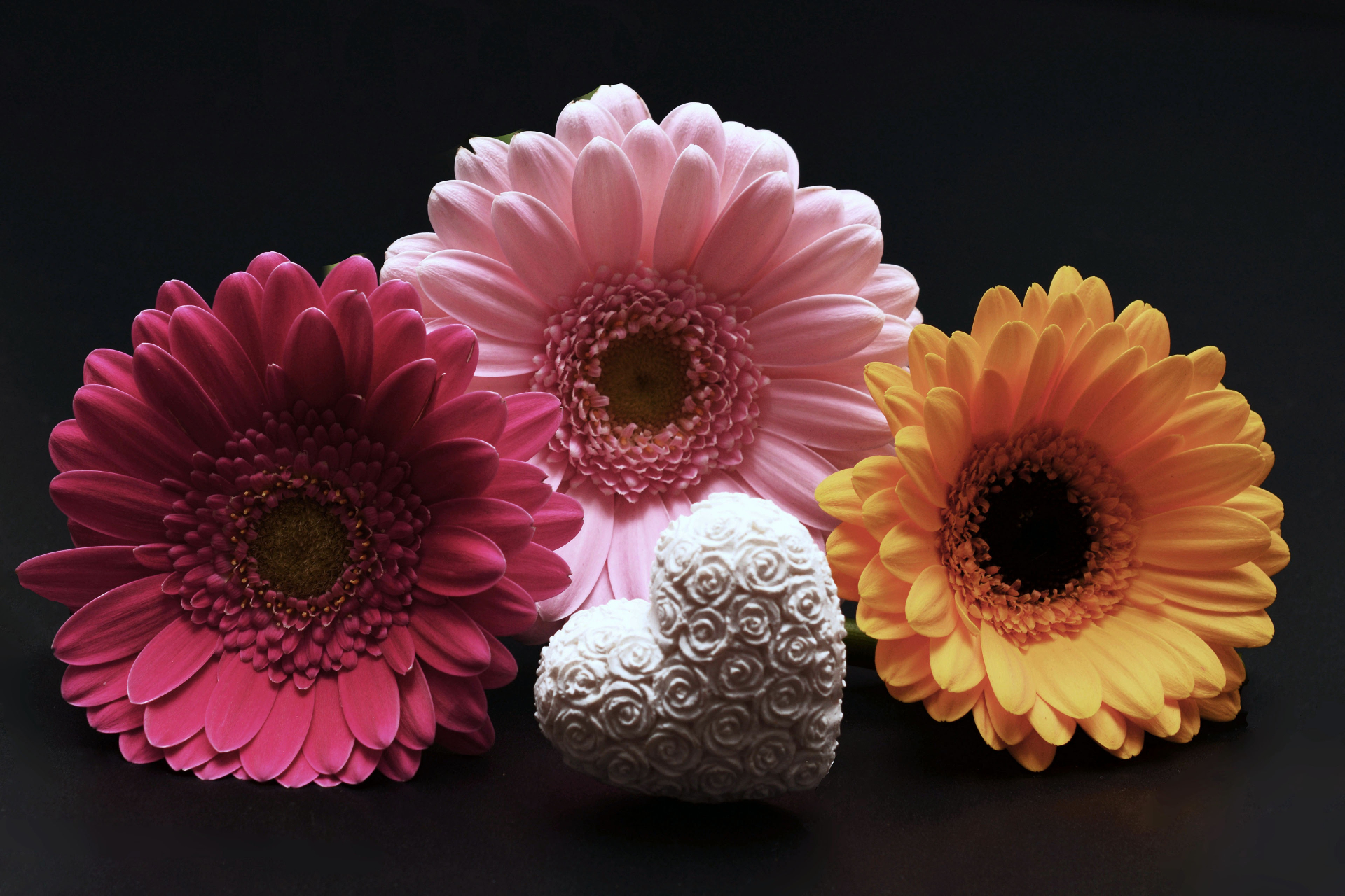 Download mobile wallpaper Flowers, Flower, Earth, Colorful, Heart, Gerbera, Yellow Flower, Pink Flower for free.