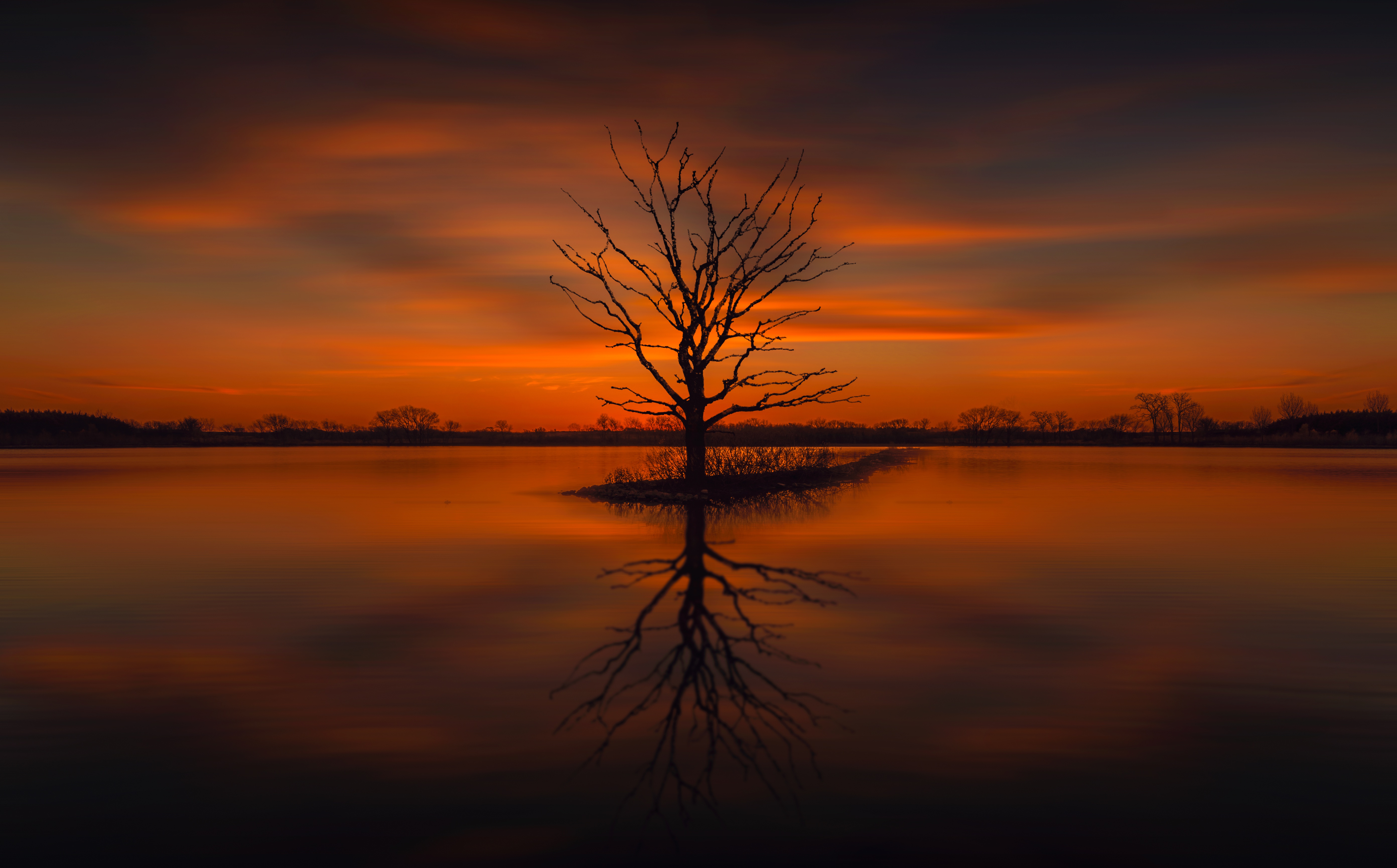 Download mobile wallpaper Nature, Trees, Sunset, Lake, Reflection, Silhouette, Tree, Earth, Orange (Color) for free.