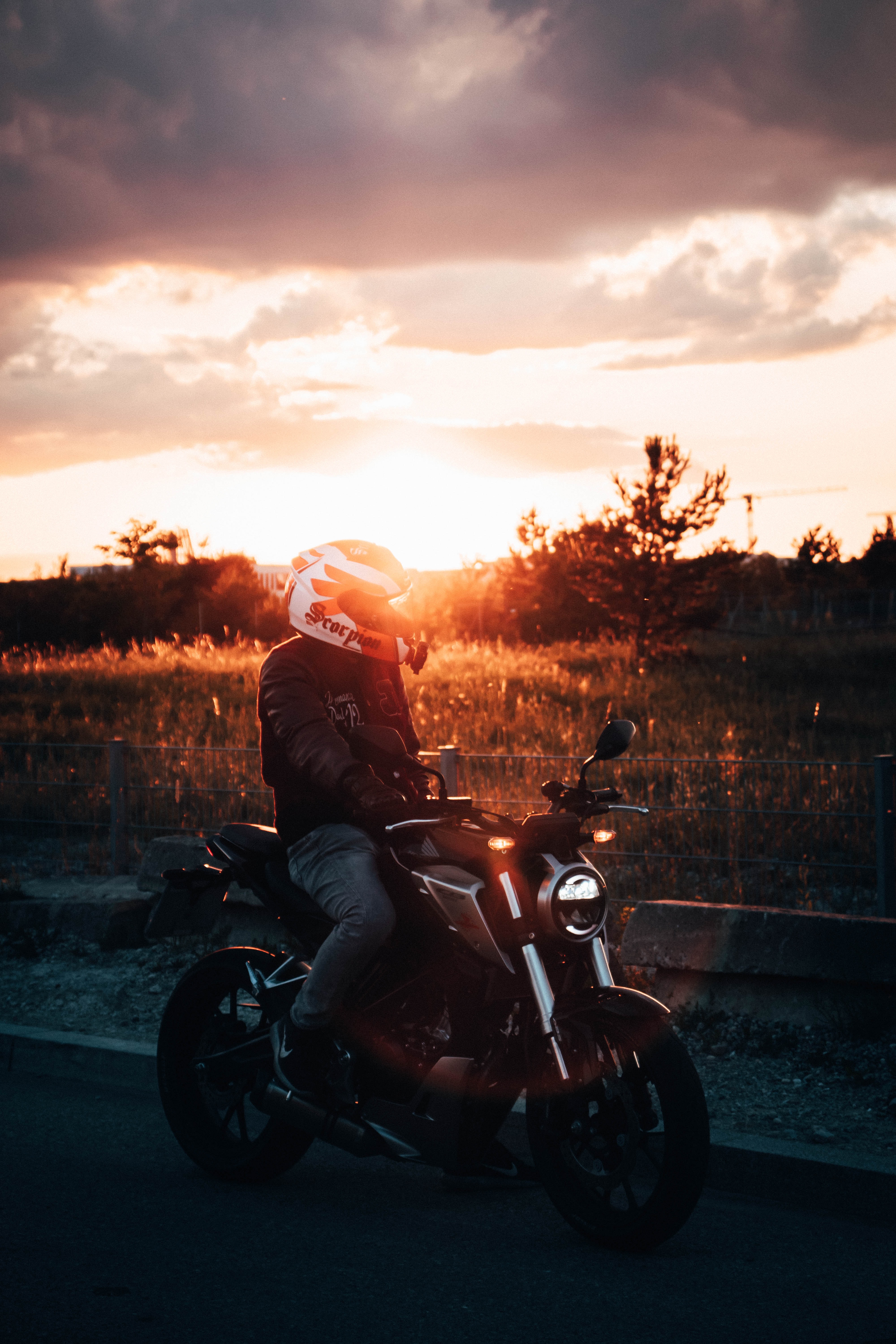 Download mobile wallpaper Sunset, Shine, Light, Motorcycle, Helmet, Motorcycles, Motorcyclist for free.